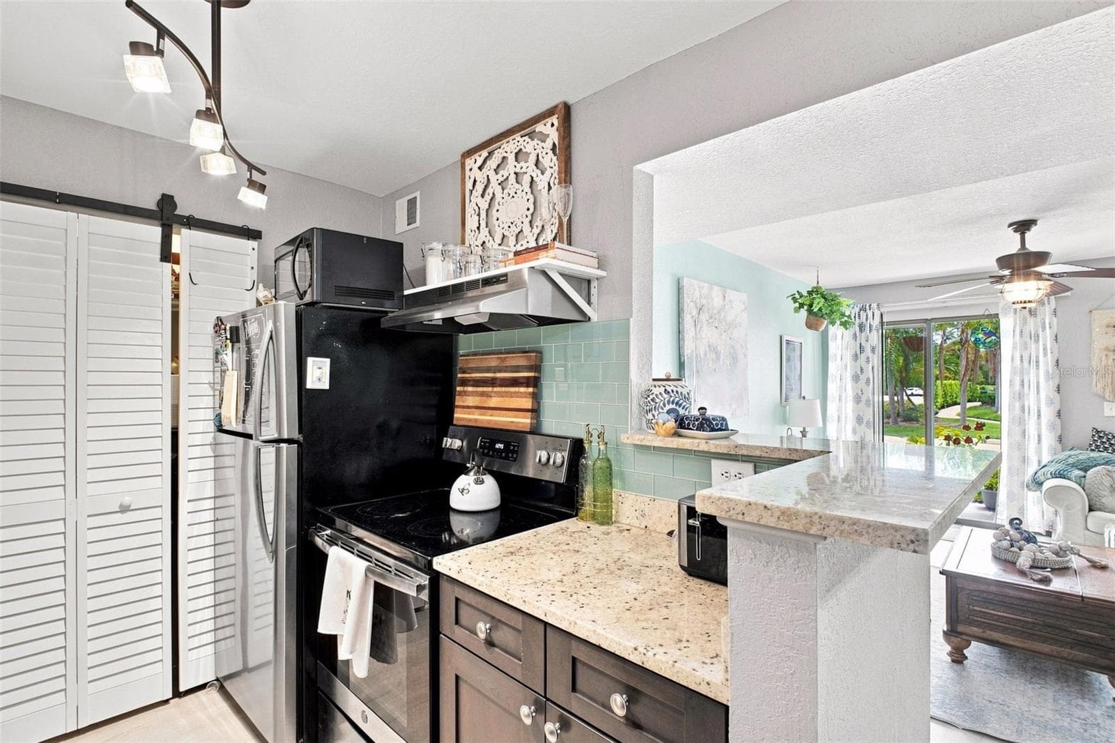 Kitchen with Outdoor Views through LR Sliders - 455 ALT 19 S #17, PALM HARBOR