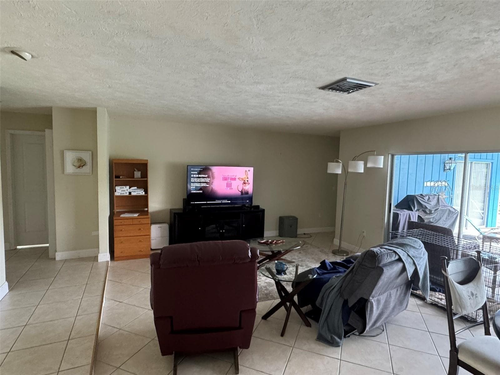 Living/dining area overlooking pool - 1009 INDIAN HILLS CT, VENICE