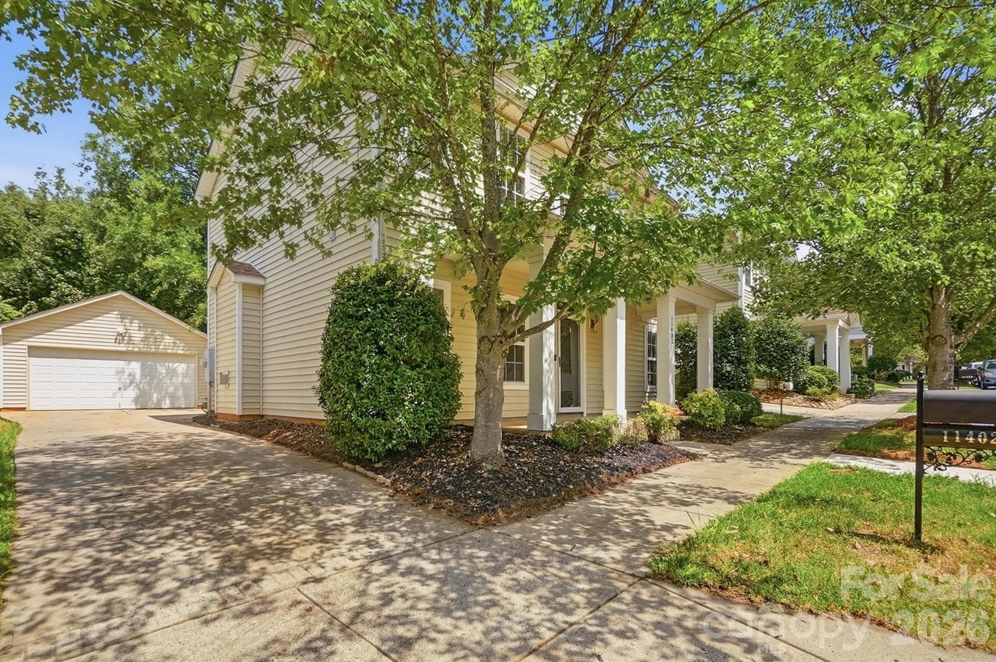 Long driveway to the detached garage - 11402 Heritage Green Drive, Cornelius