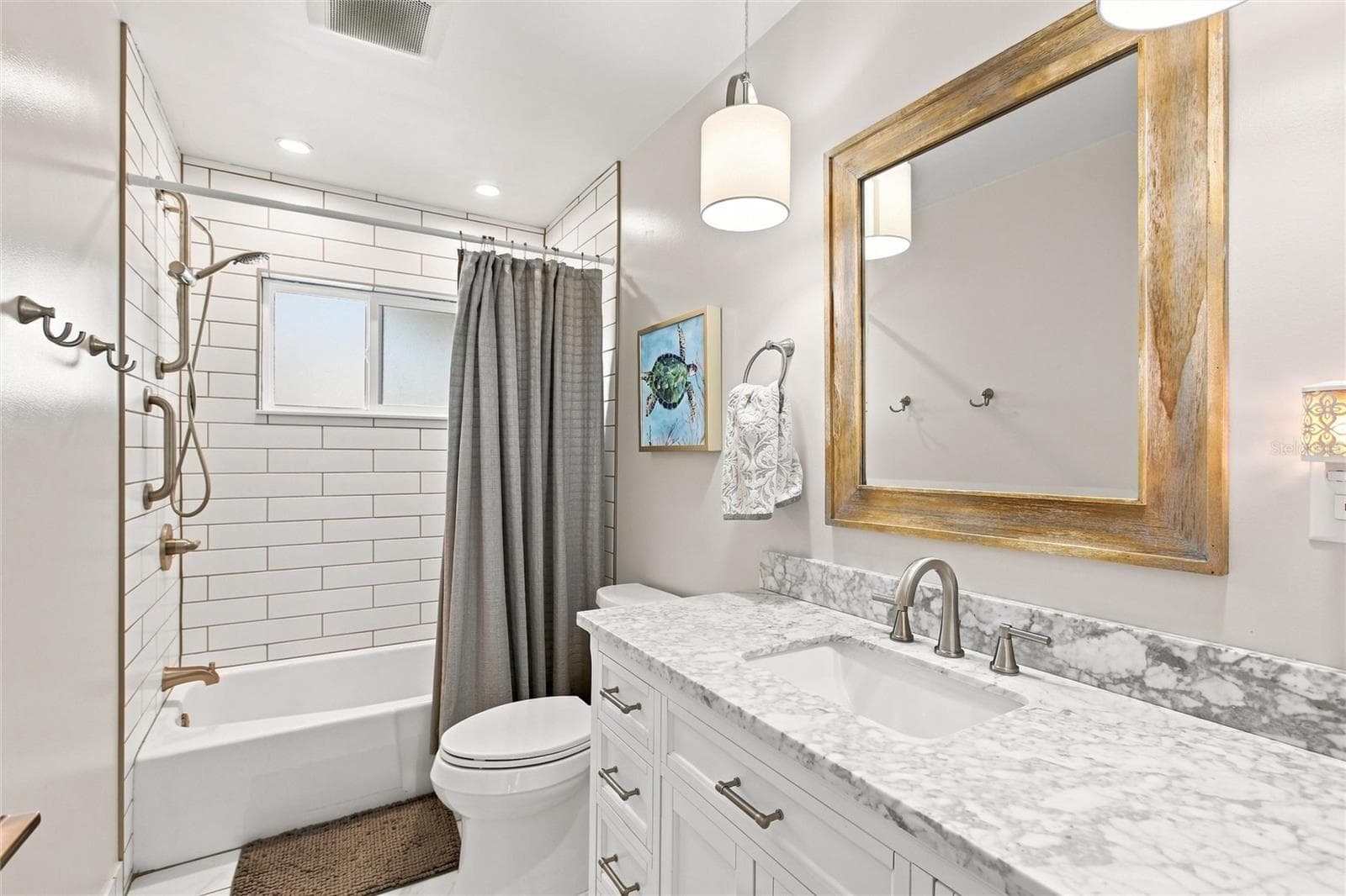 Guest Bathroom with tub and tile shower - 302 DEGAS DR, NOKOMIS