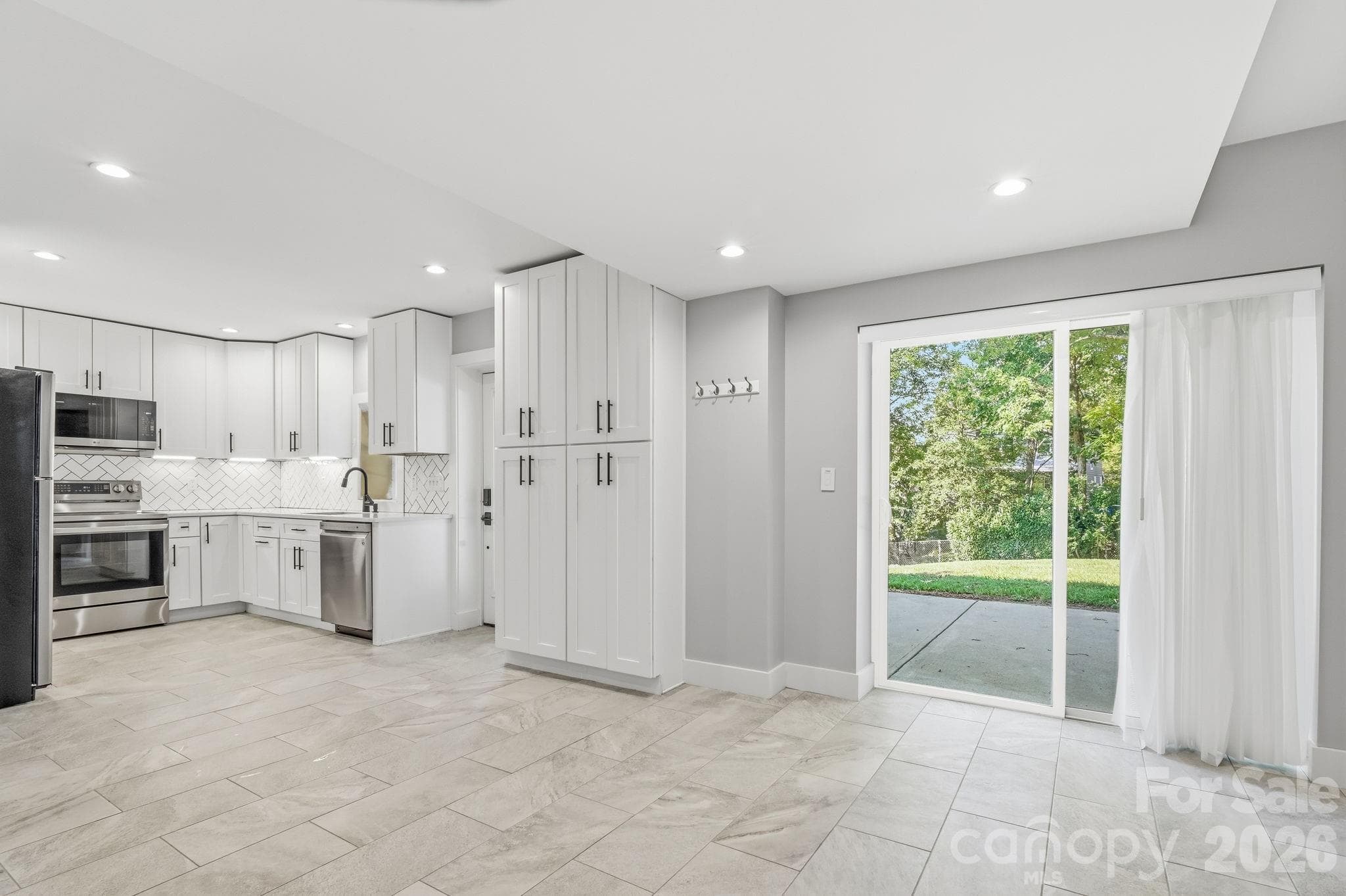 From dining room to kitchen - 77 Trotter Place, Asheville