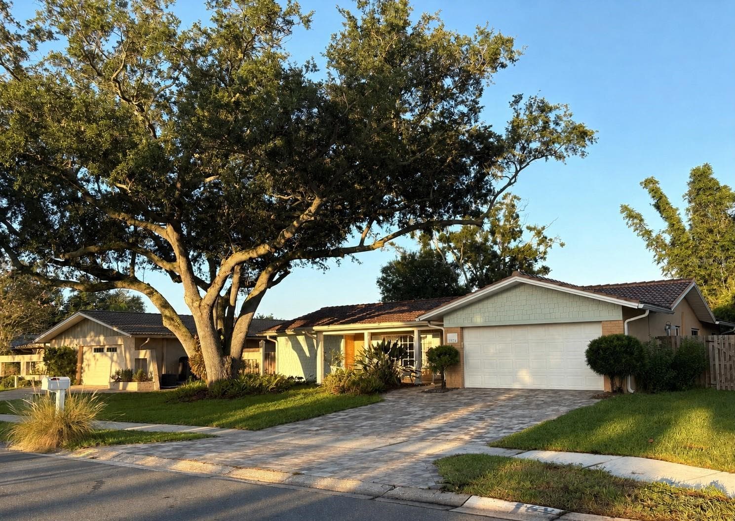 Alt. Exterior view. Newer paver driveway. - 1874 WATEROAK DR W, CLEARWATER