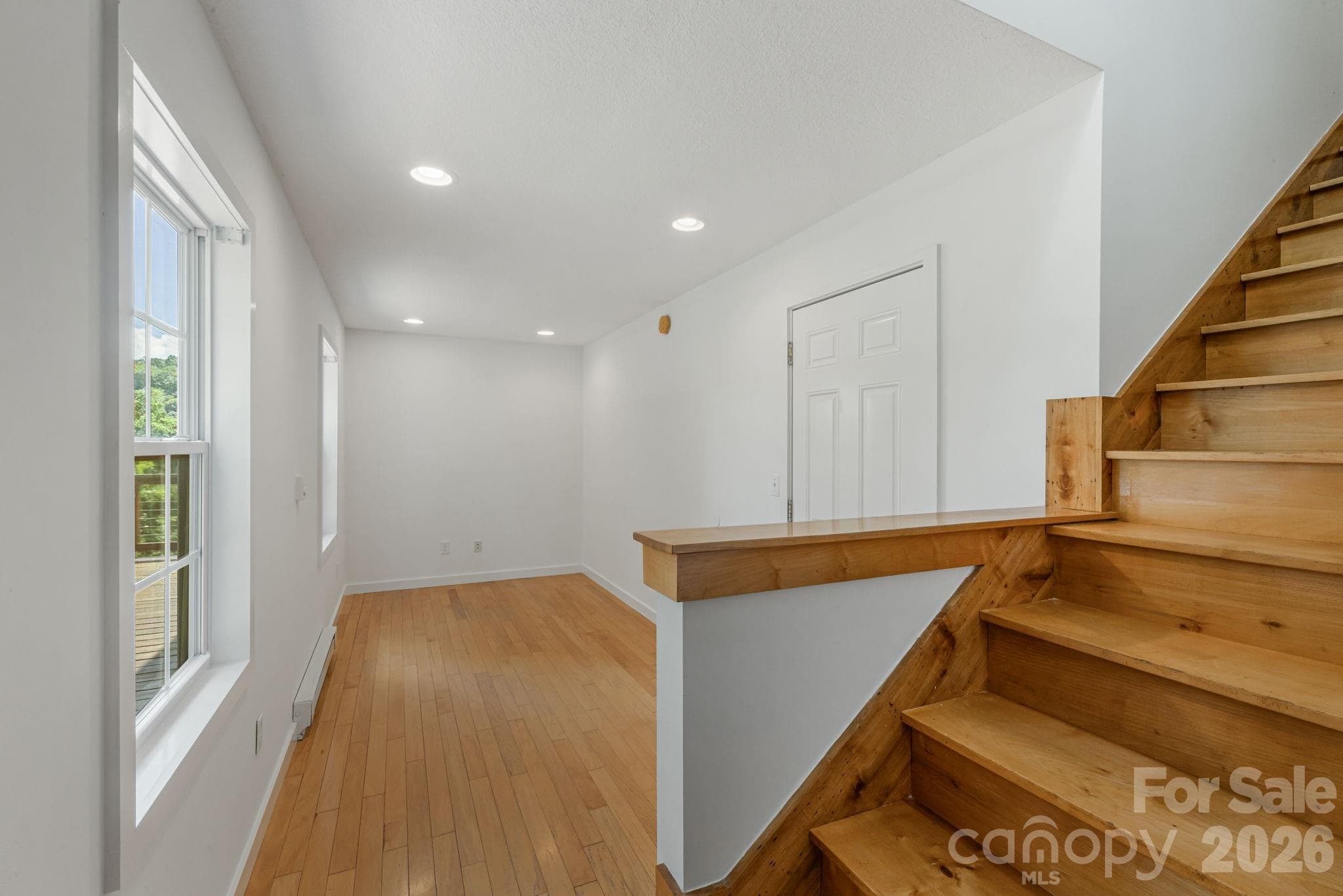 Large area at the bottom of the stair where the current owners had it set up as an office - 184 Scarlett Ridge Drive, Marshall