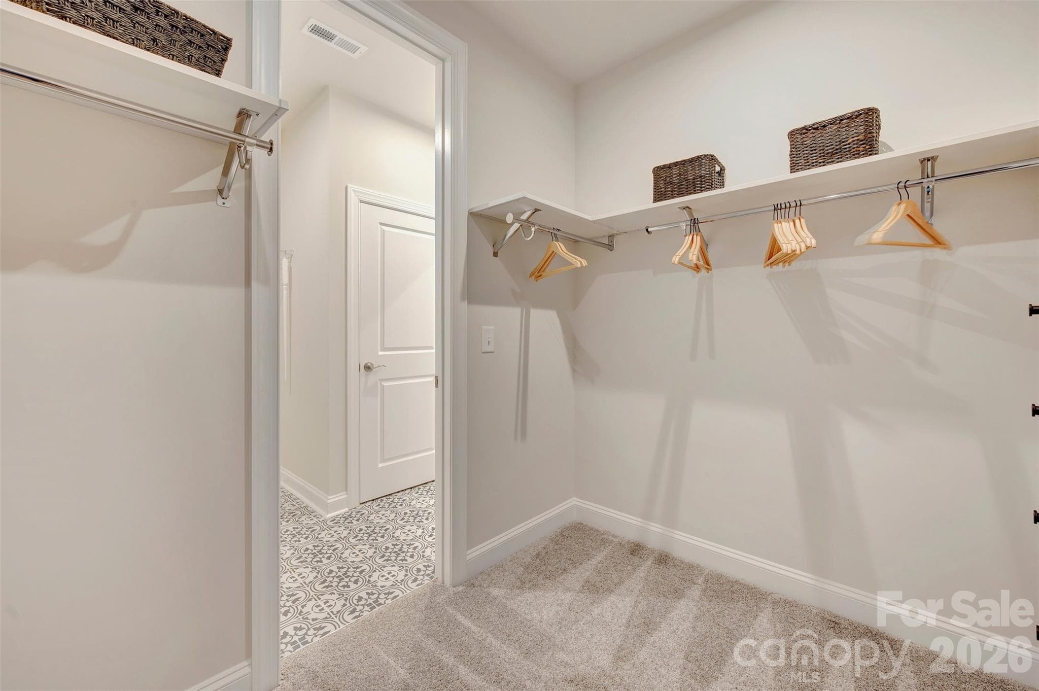 Primary walk-in closet with connection to the laundry room - 309 Old Town Village Road, Waxhaw