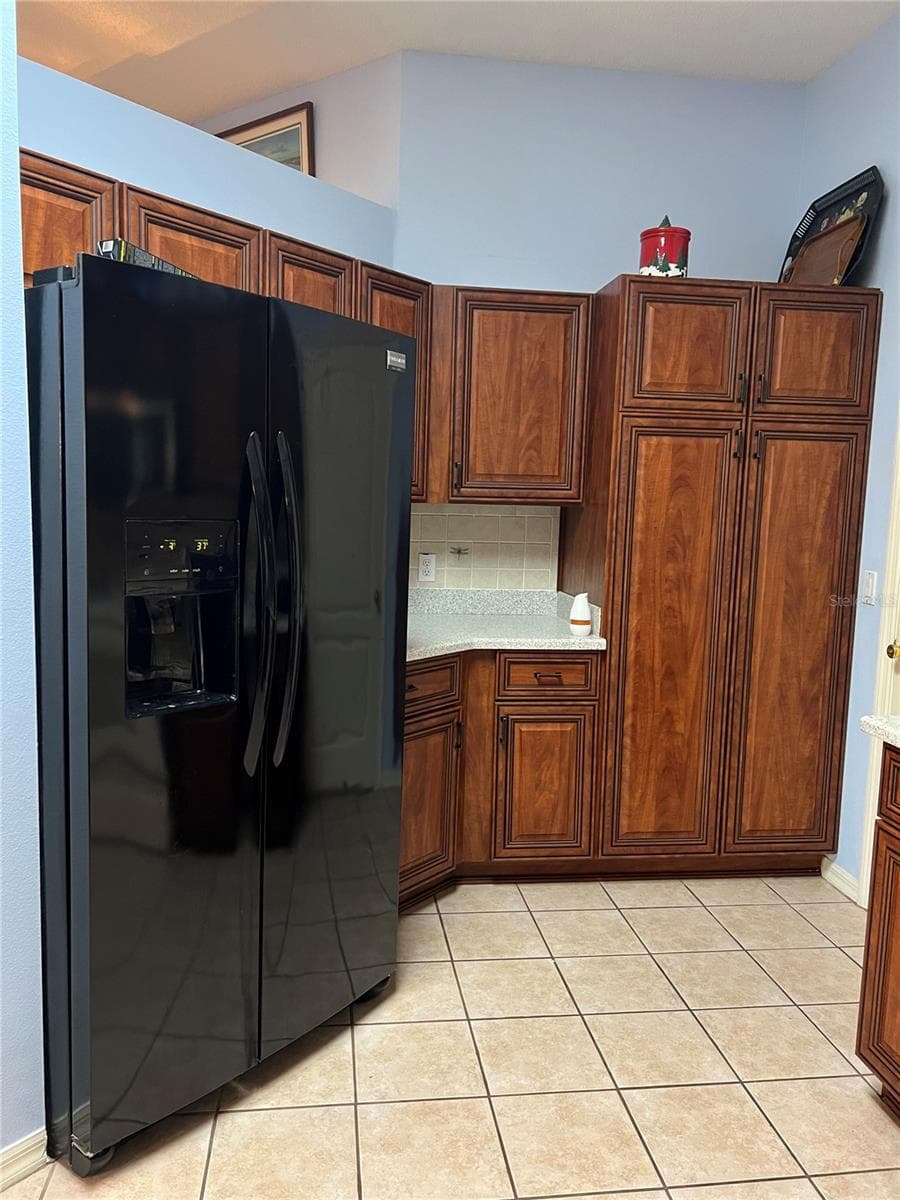 Kitchen with Pantry, Solid Surface Countertops and Tile Backsplash and Tile flooring with tall ceilings - 1842 PUERTO BELLO DR, THE VILLAGES