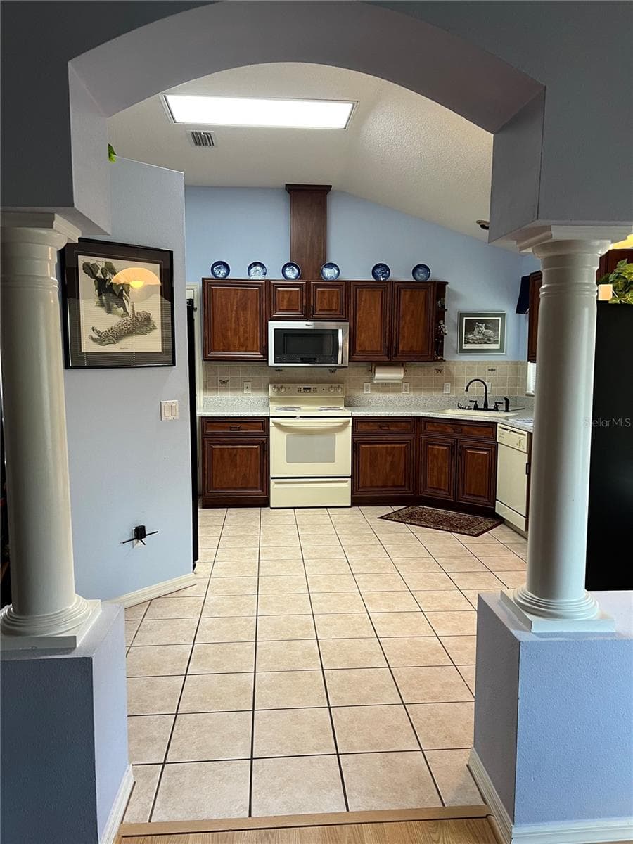 View from Dining Room to Kitchen - 1842 PUERTO BELLO DR, THE VILLAGES