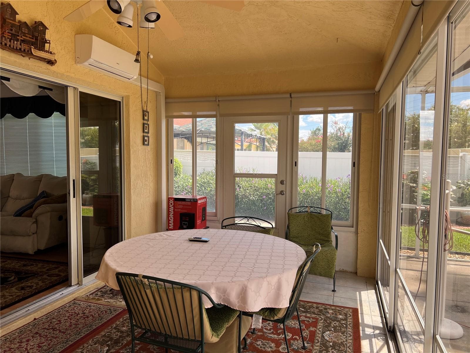 Enclosed Lanai with Mini Split HVAC and collapsable doors to outside Screen Room with Hot Tub - 1842 PUERTO BELLO DR, THE VILLAGES
