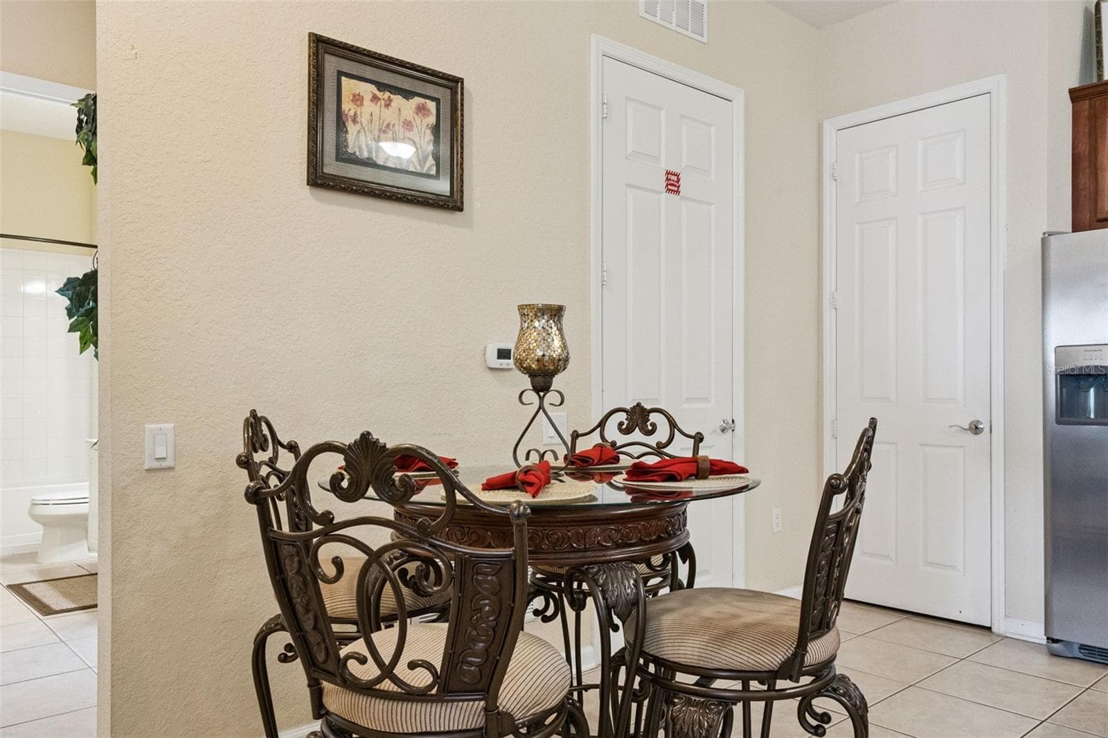 Dining Alcove:Dedicated dining alcove with tile flooring, set conveniently next to kitchen appliances and utility closets. - 4840 CAYVIEW AVE #405, ORLANDO