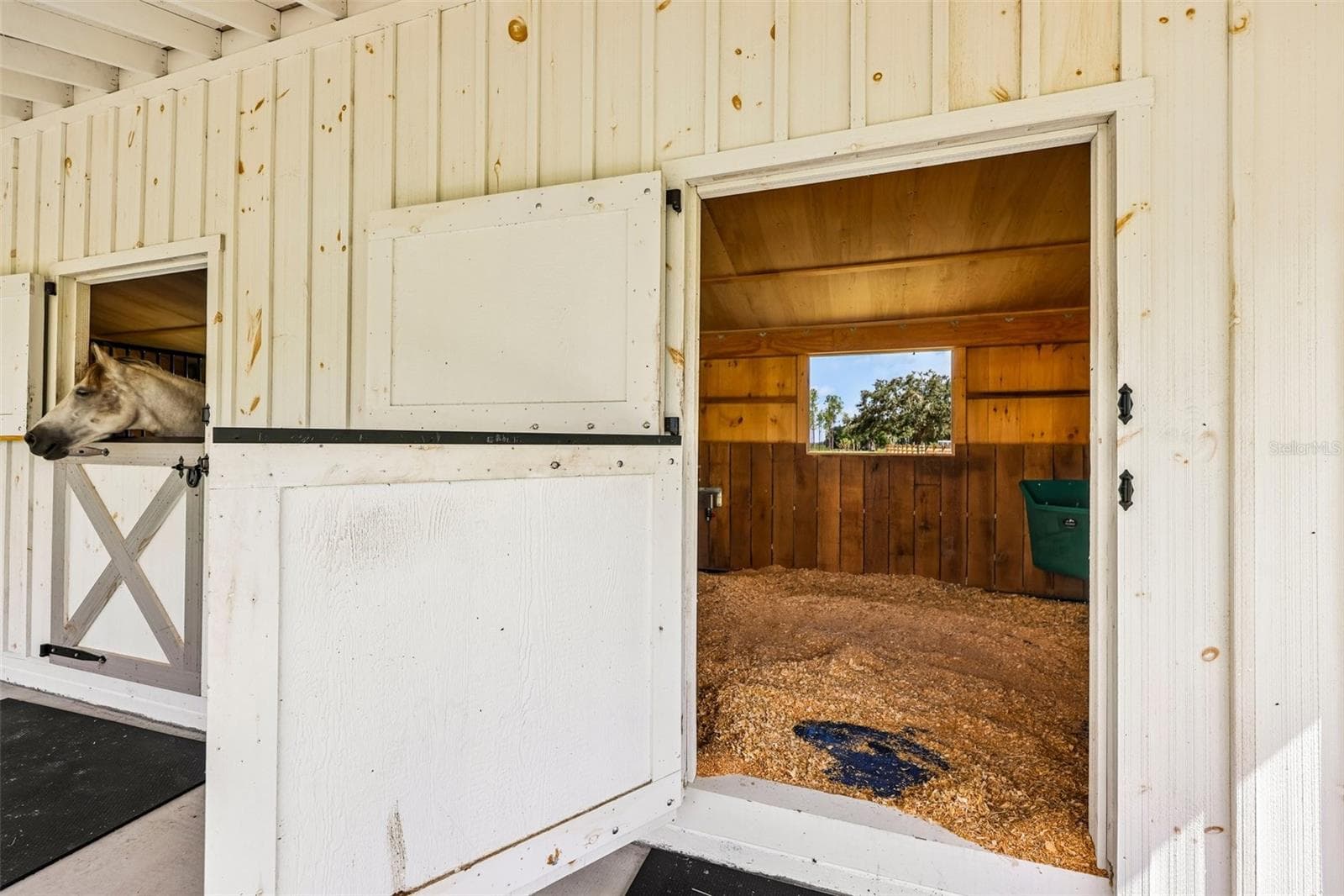 Each stall features premium SoftStall® high-density rubber matting from Canada. - 2088 NW 102ND BLVD, WILDWOOD
