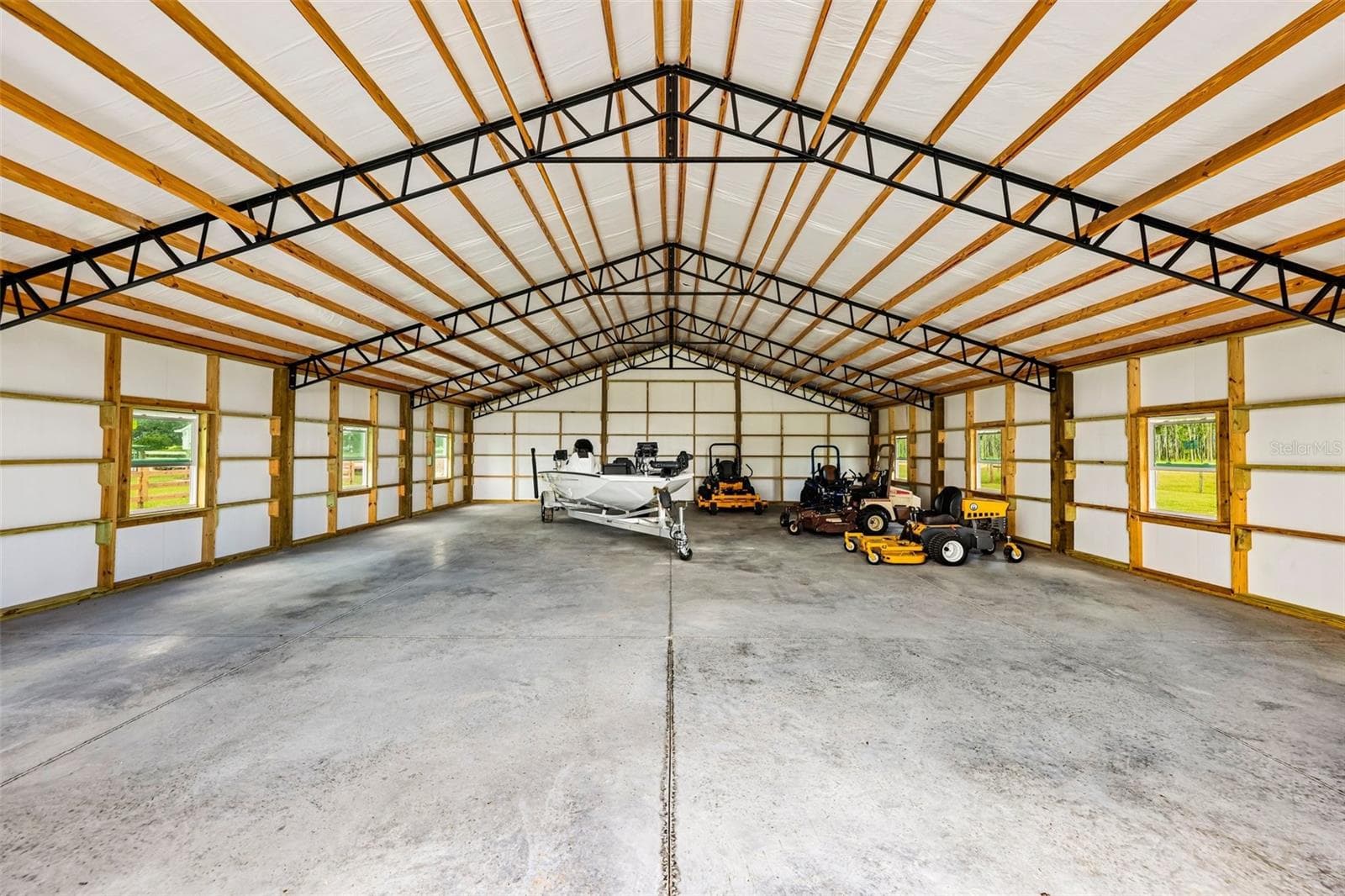 The barn features exceptional construction with meticulous framing and insulated walls and ceiling, creating a well-built, versatile space. - 2088 NW 102ND BLVD, WILDWOOD