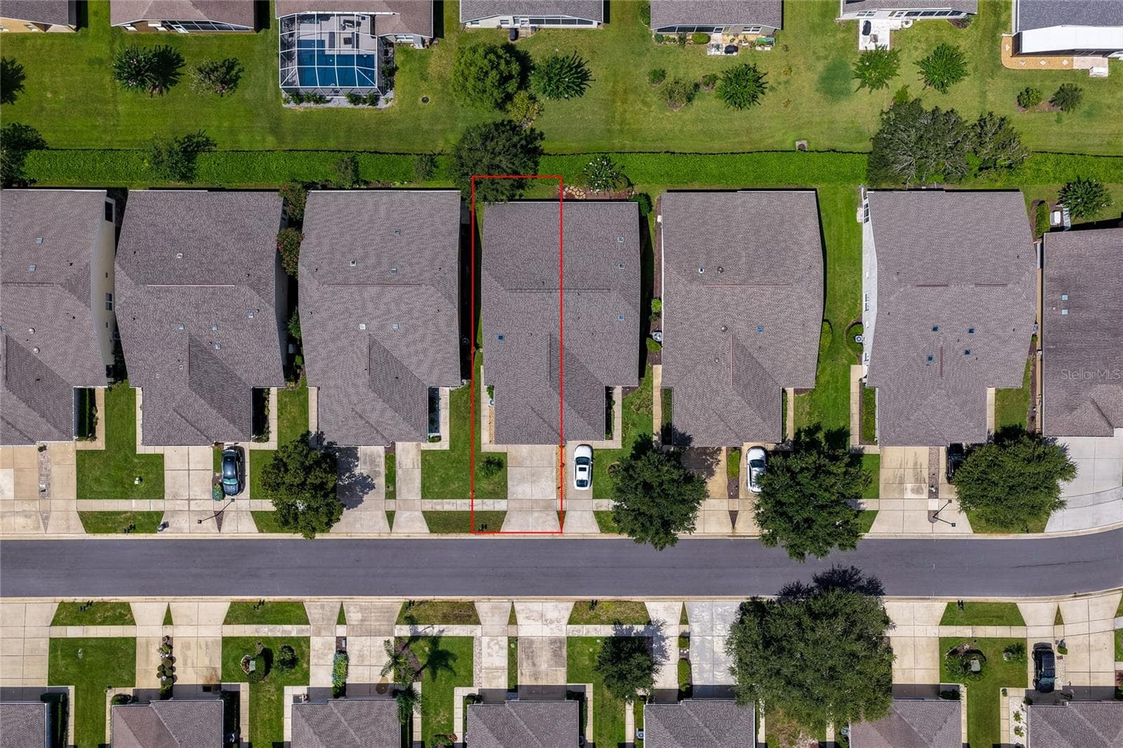Direct overhead aerial view showcasing the structured street grid and property boundaries, with a red box outlining a specific home parcel and its private lot. - 1413 COCONUT PALM CIR, PORT ORANGE