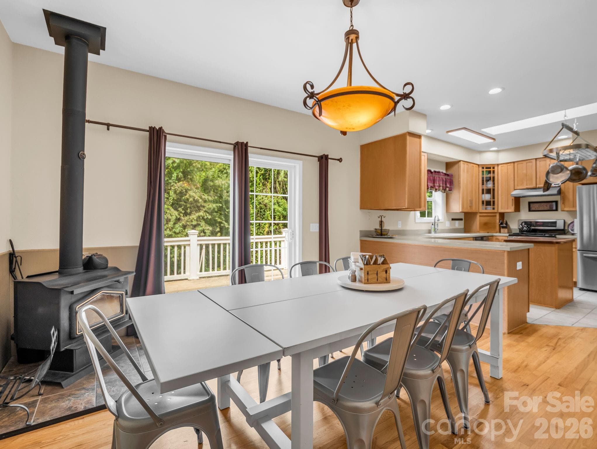 Dining room with wood burning stove for cold days and a second heat source - 136 Limousine Lane, Pisgah Forest