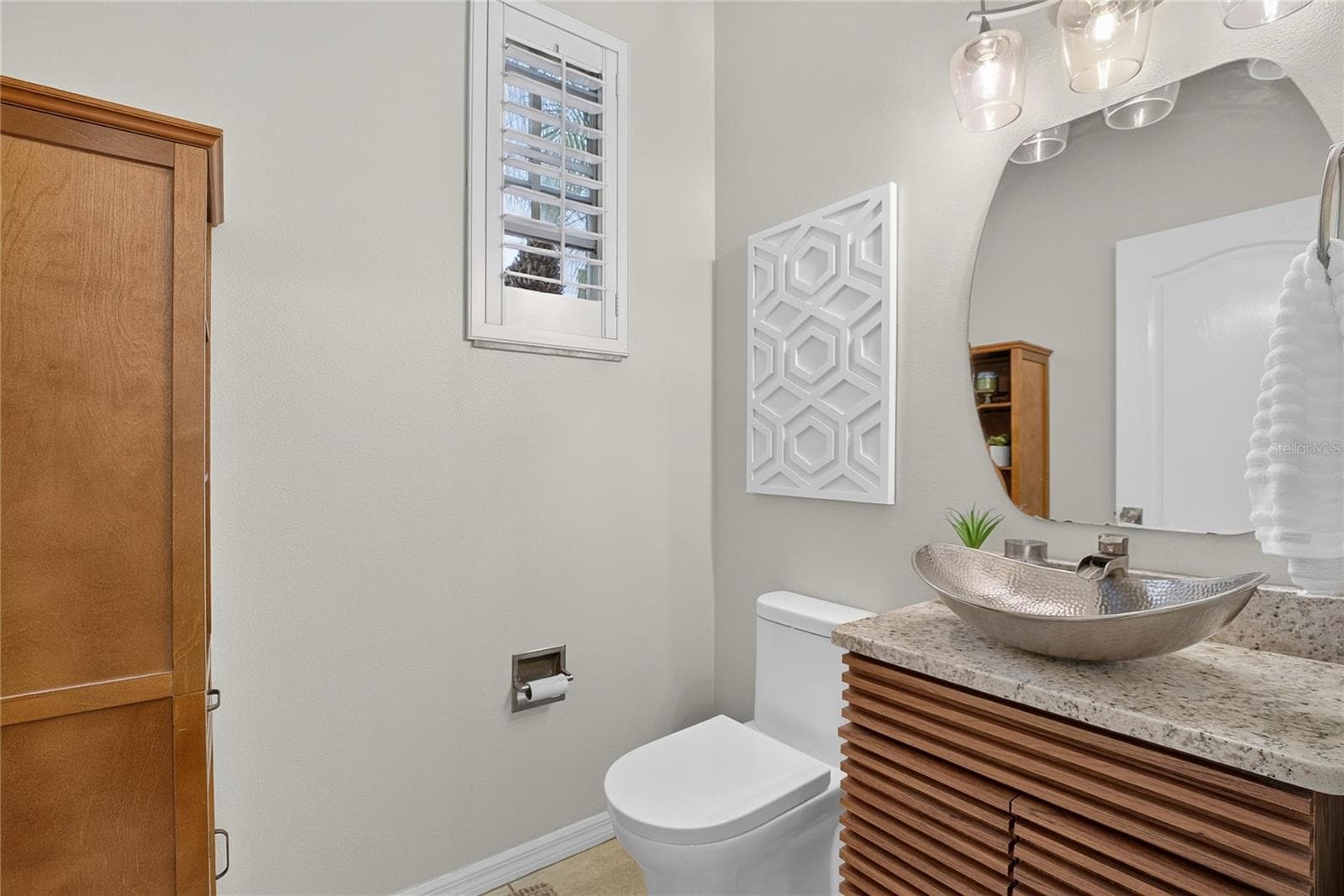 Convenient half bath located just off the entry. - 10807 SIERRA VISTA PL, TAMPA