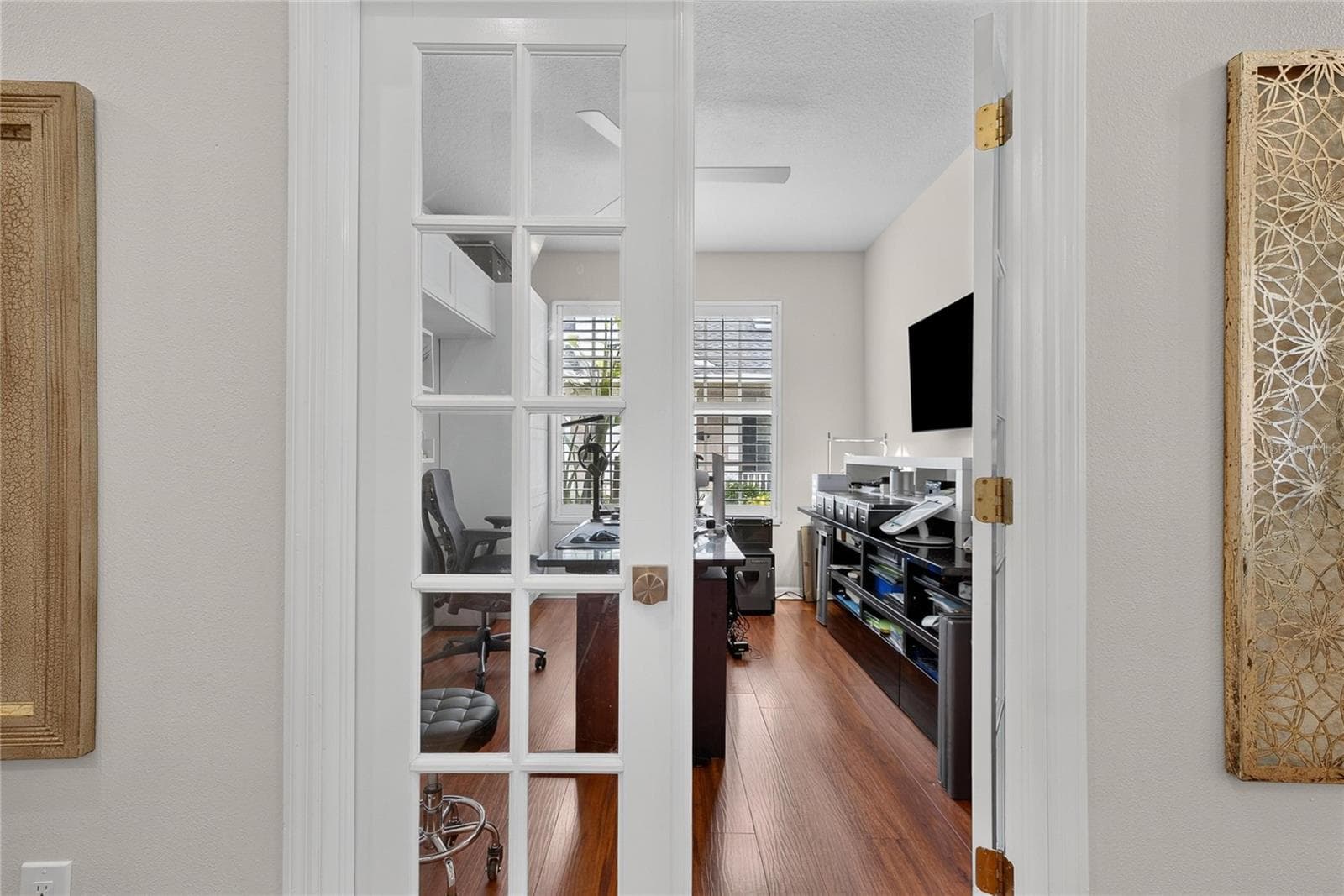 French doors open to a private den, ideal for a home office, study or flex space - 10807 SIERRA VISTA PL, TAMPA