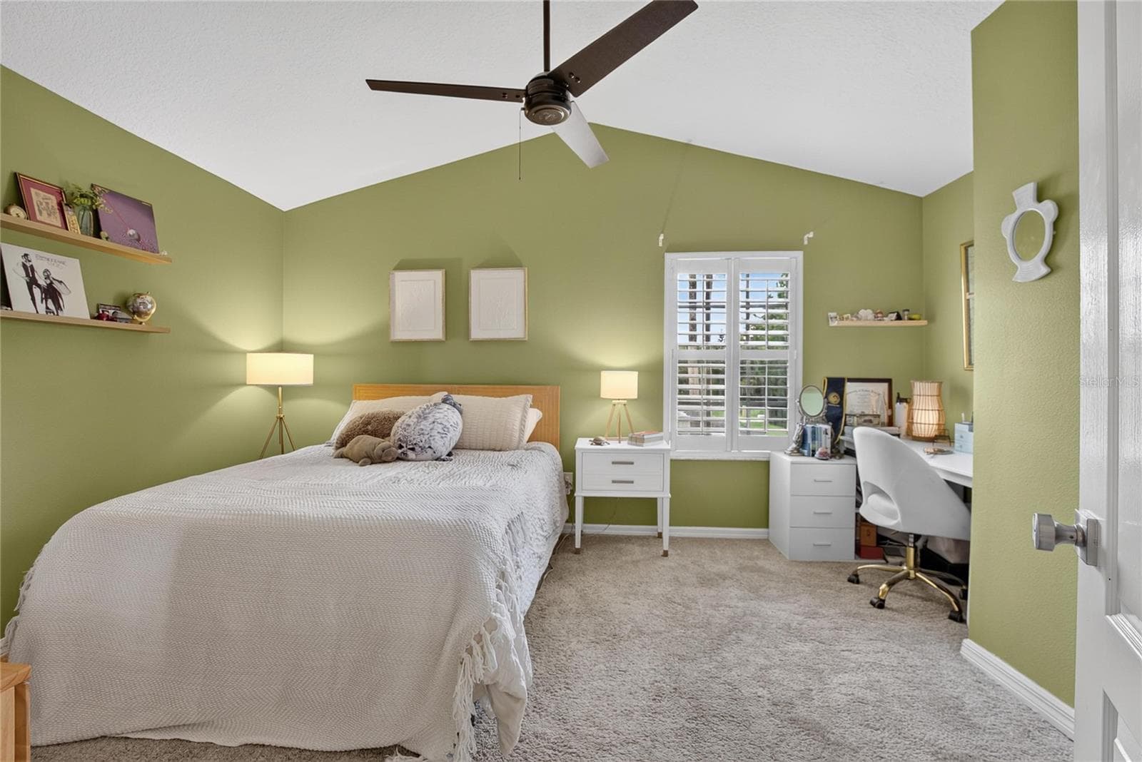 Spacious secondary bedroom with vaulted ceiling, plantation shutters and plenty of room for a desk or study area. - 10807 SIERRA VISTA PL, TAMPA