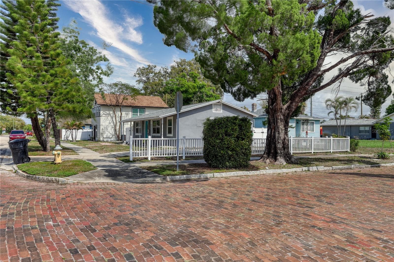 A charming cobblestone street adds a touch of timeless Old Florida character to the property’s St. Petersburg setting. - 116 44TH ST S, ST PETERSBURG
