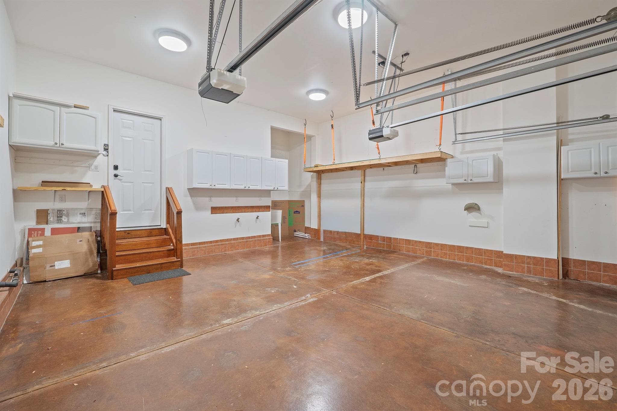 2 car garage with storage and utility sink - 14509 Greenpoint Lane, Huntersville