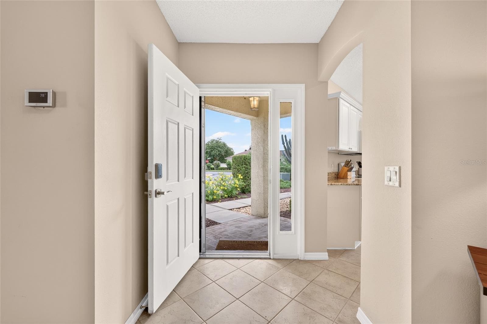 Looking back at beautiful front landscaping! - 17198 SE 84TH KNIGHT AVE, THE VILLAGES