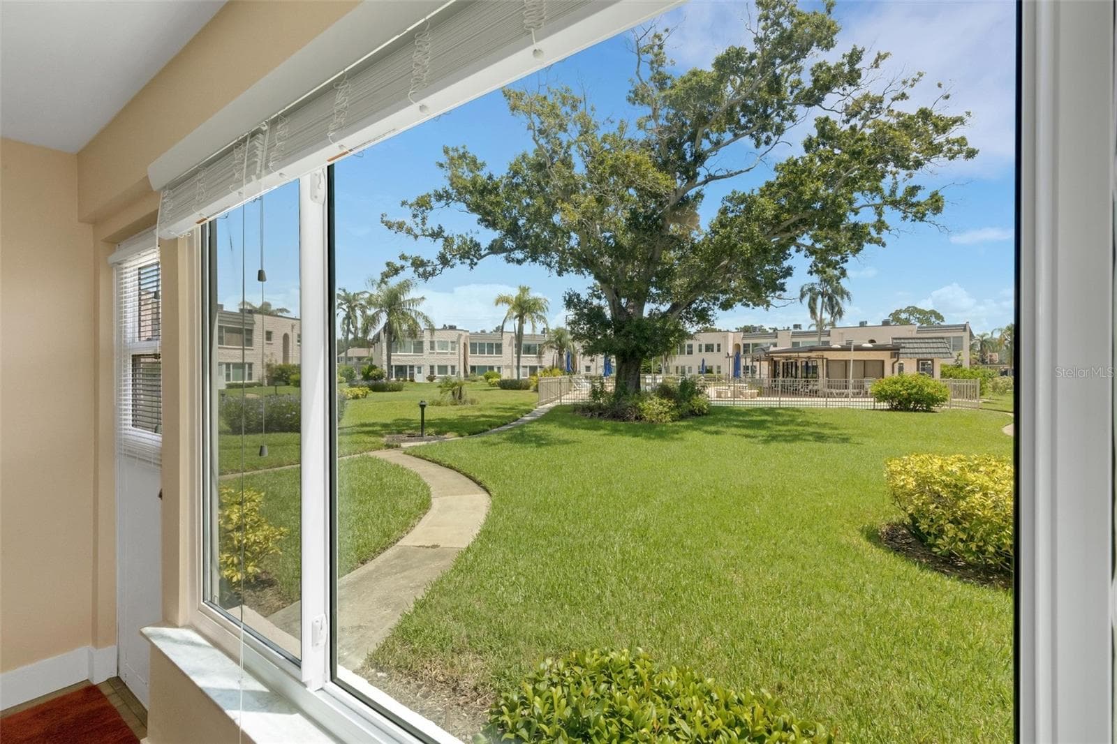 Pool and Clubhouse View from Florida Room - 112 ELMWOOD CIR #112, SEMINOLE