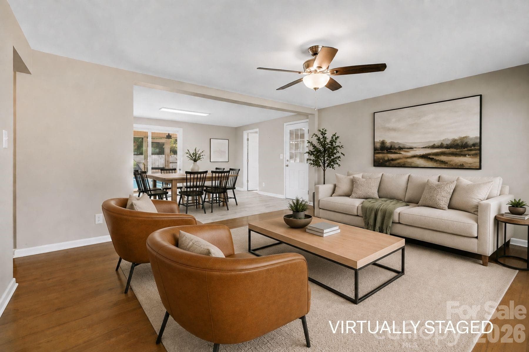 Living room opens to dining room. (virutally staged) - 409 Oak Street Extension, Forest City