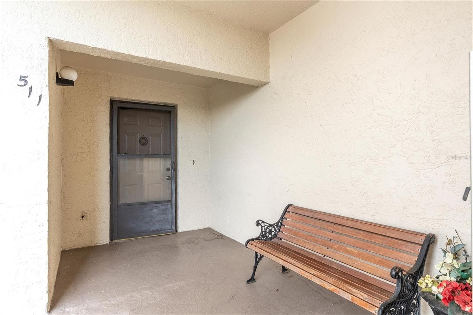 Private outdoor entry to the unit. - 8198 TERRACE GARDEN DR #511, ST PETERSBURG