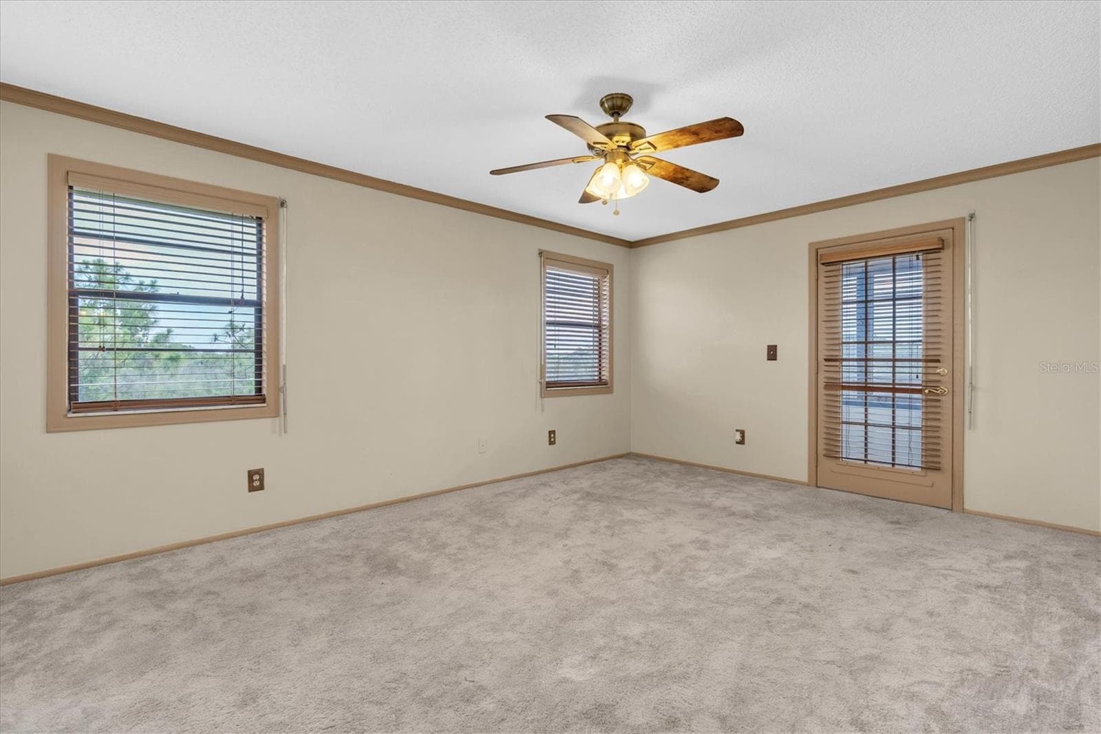 Primary bedroom with an additional enclosed patio - 8198 TERRACE GARDEN DR #511, ST PETERSBURG