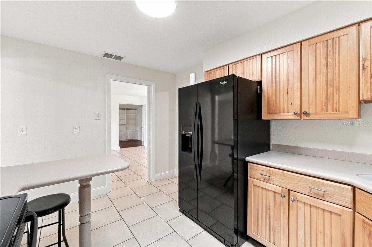 Kitchen with entry to dining room - 121 LOWELL RD, WINTER HAVEN