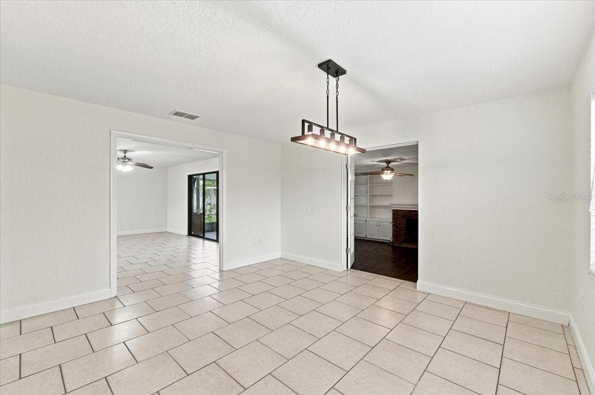 Dining room with entry to kitchen and living room - 121 LOWELL RD, WINTER HAVEN