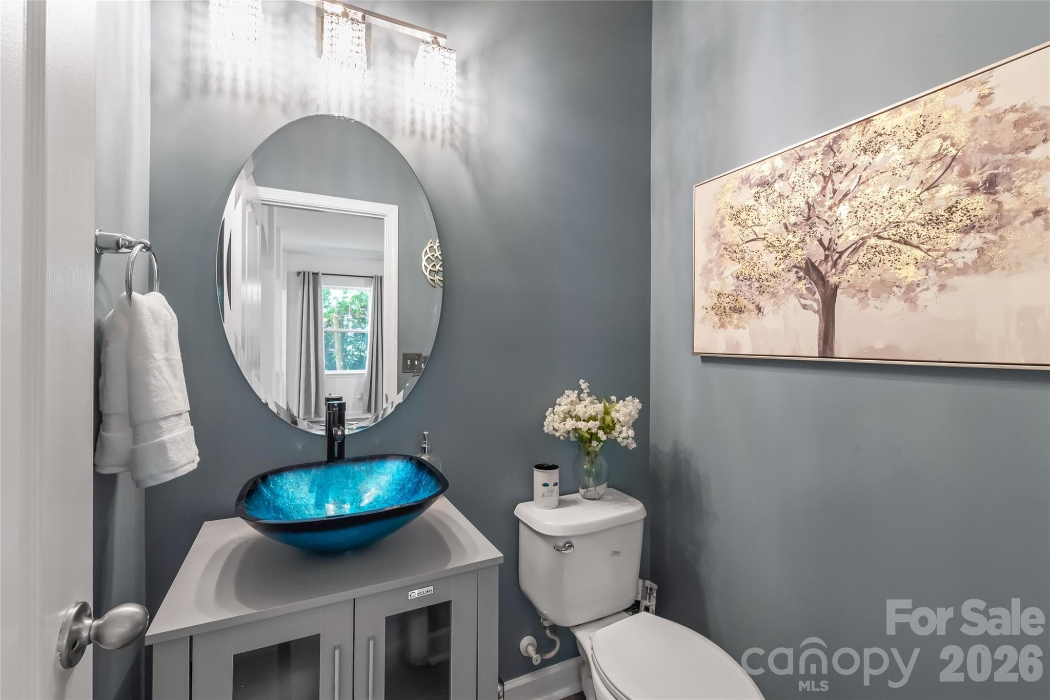 "A lower-level half bath that provides a relaxing, spa-like atmosphere." - 6404 Lanzerac Manor Drive, Charlotte