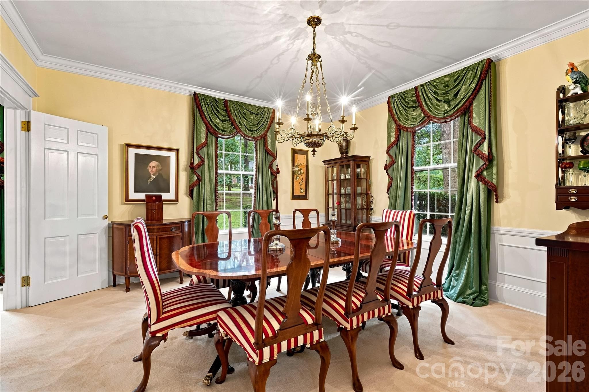 Formal dining room with wainscoting and built-in cabinetry. - 209 Labans Lane, Lincolnton