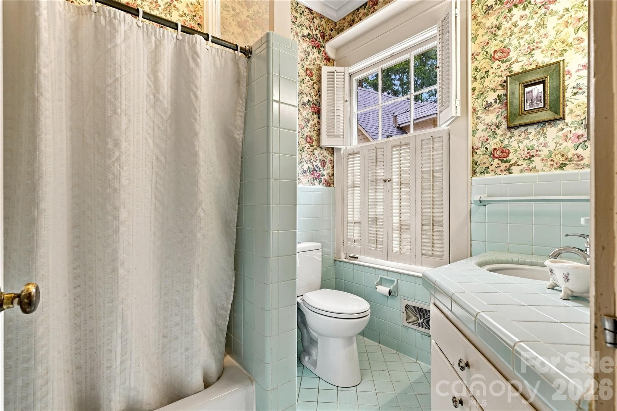 Private ensuite bath serving the main-level bedroom. - 209 Labans Lane, Lincolnton