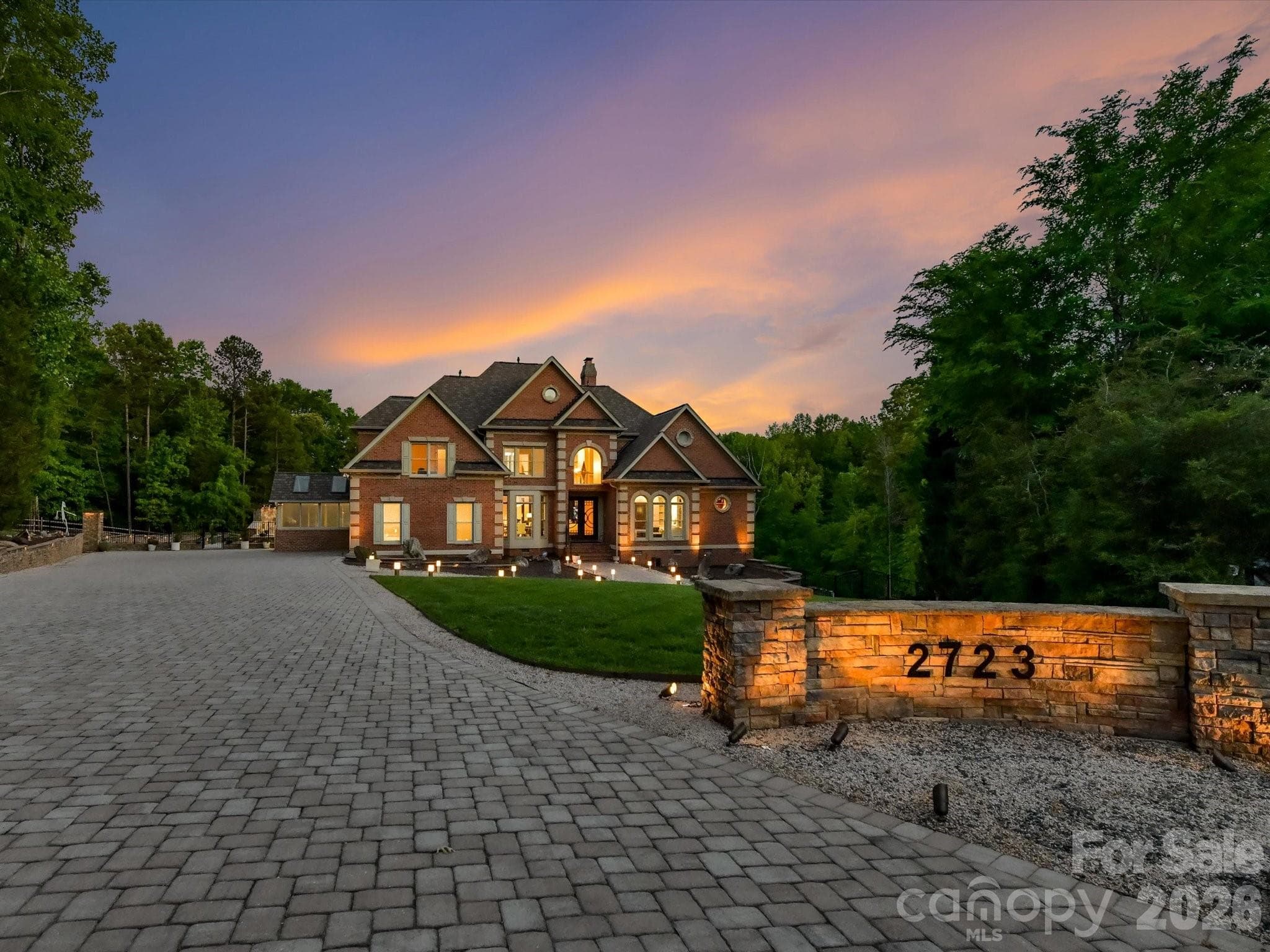 A custom paver driveway with parking for 12 cars. - 2723 Providence Pine Lane, Charlotte
