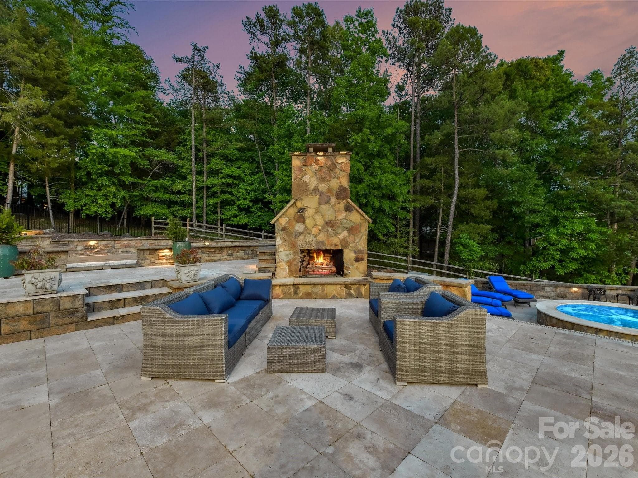 Twilight at the outdoor fireplace. - 2723 Providence Pine Lane, Charlotte