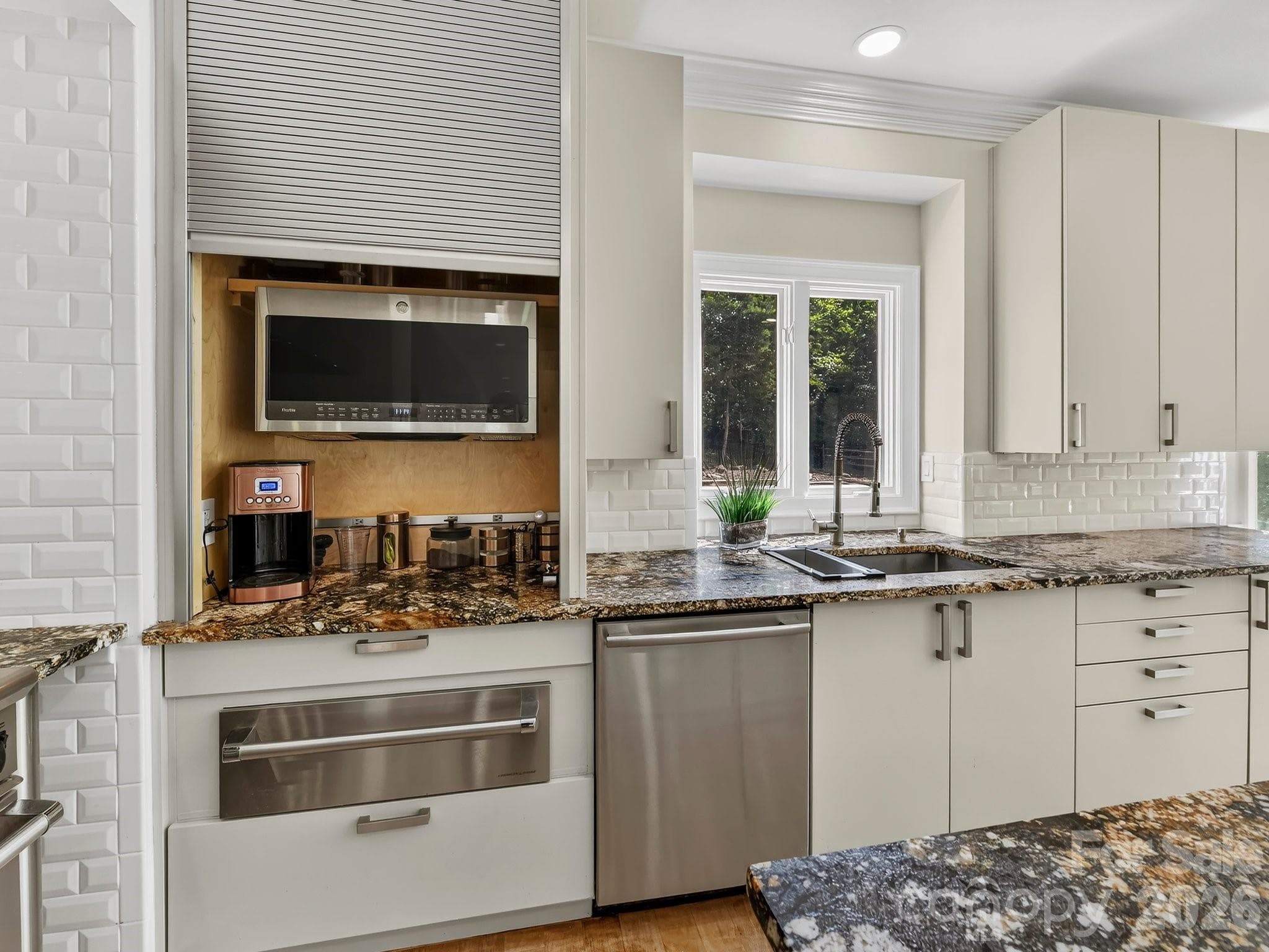 Warming drawer & a microwave & coffee station which can be hidden from view when desired. - 2723 Providence Pine Lane, Charlotte
