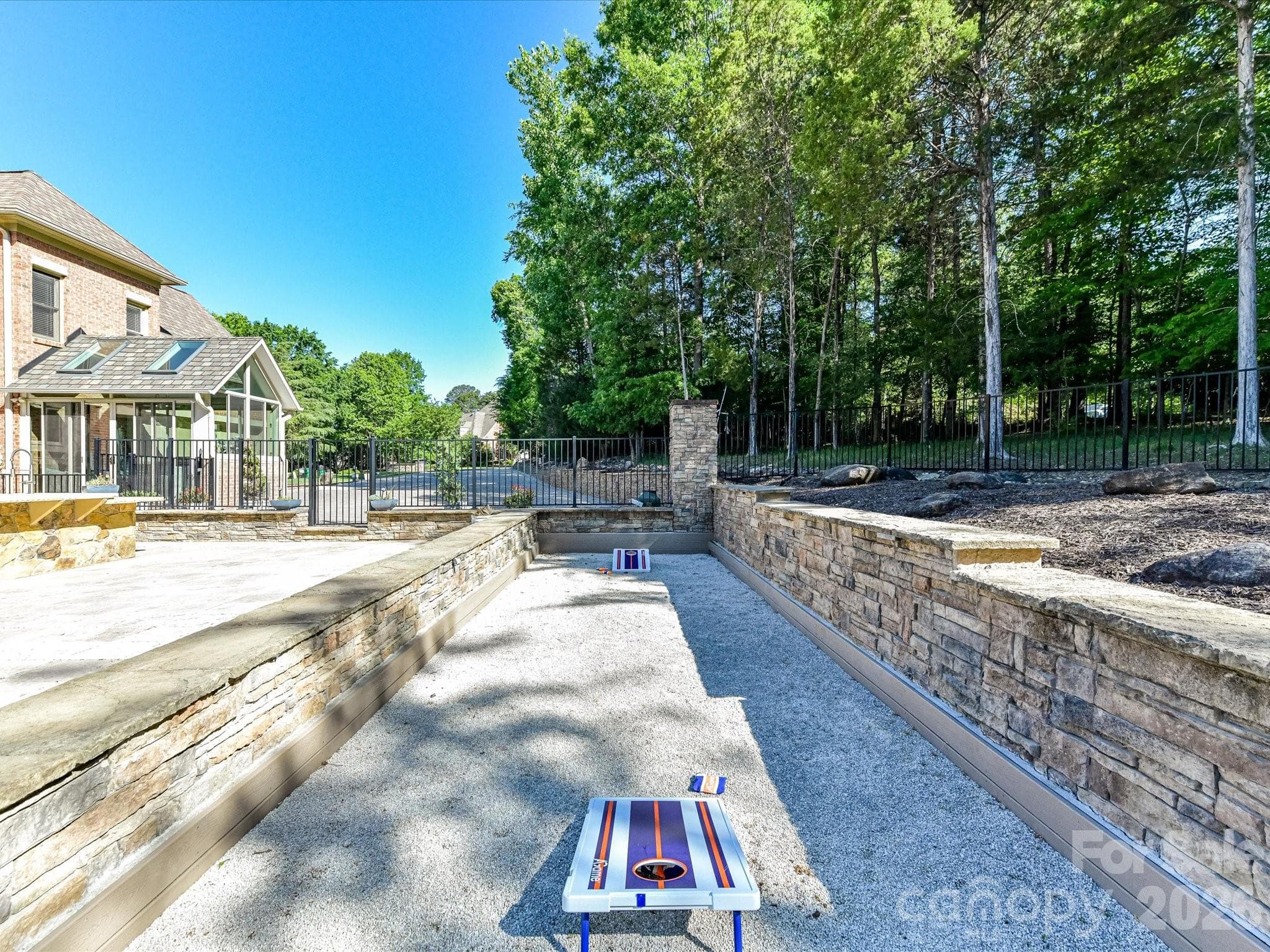 Regulation-sized bocce court is also a great place to enjoy corn hole game play. - 2723 Providence Pine Lane, Charlotte