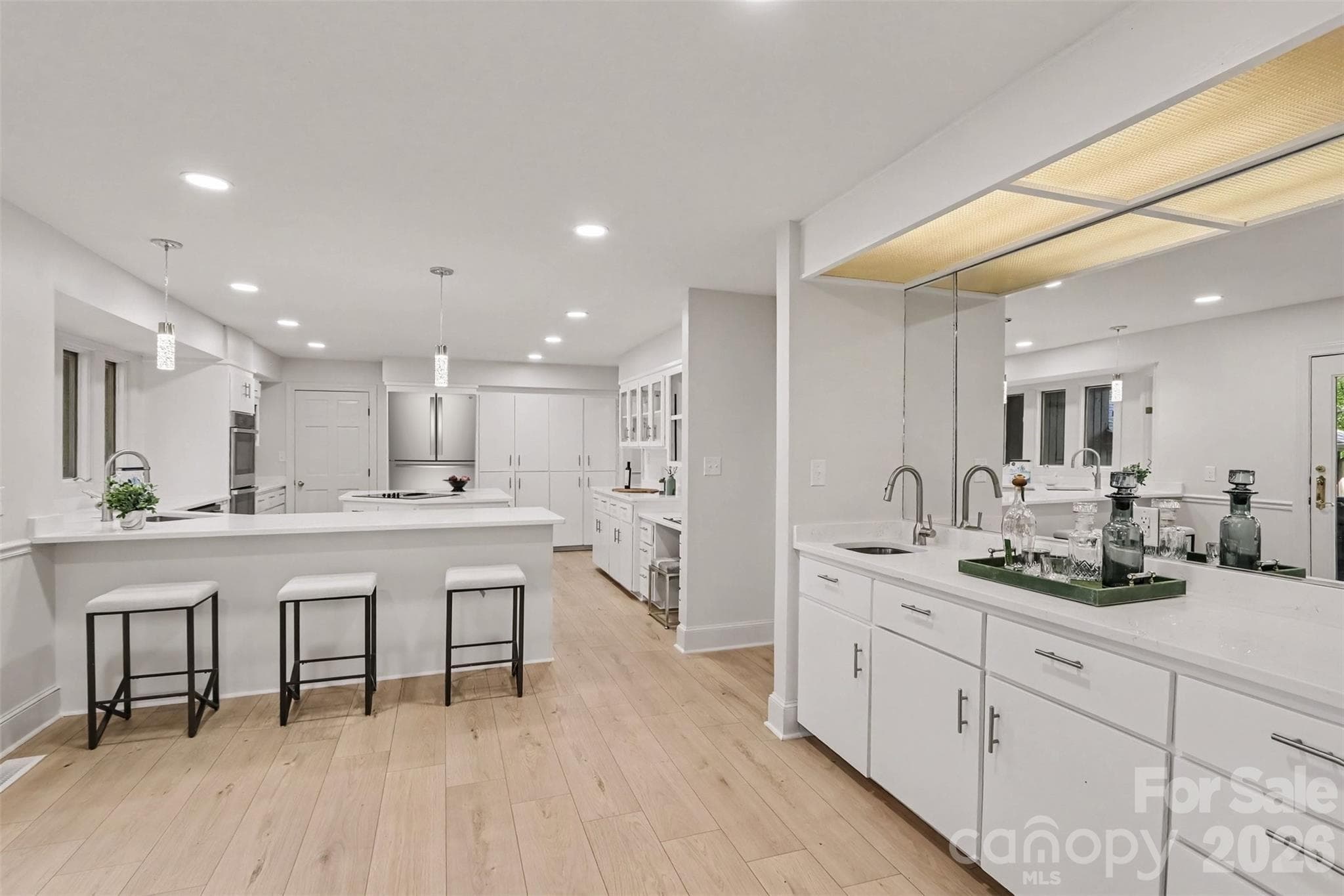 Cocktails, anyone/everyone!?! Check out your new wet bar that bridges the kitchen and the great room. - 5042 Marci Lane, Belmont
