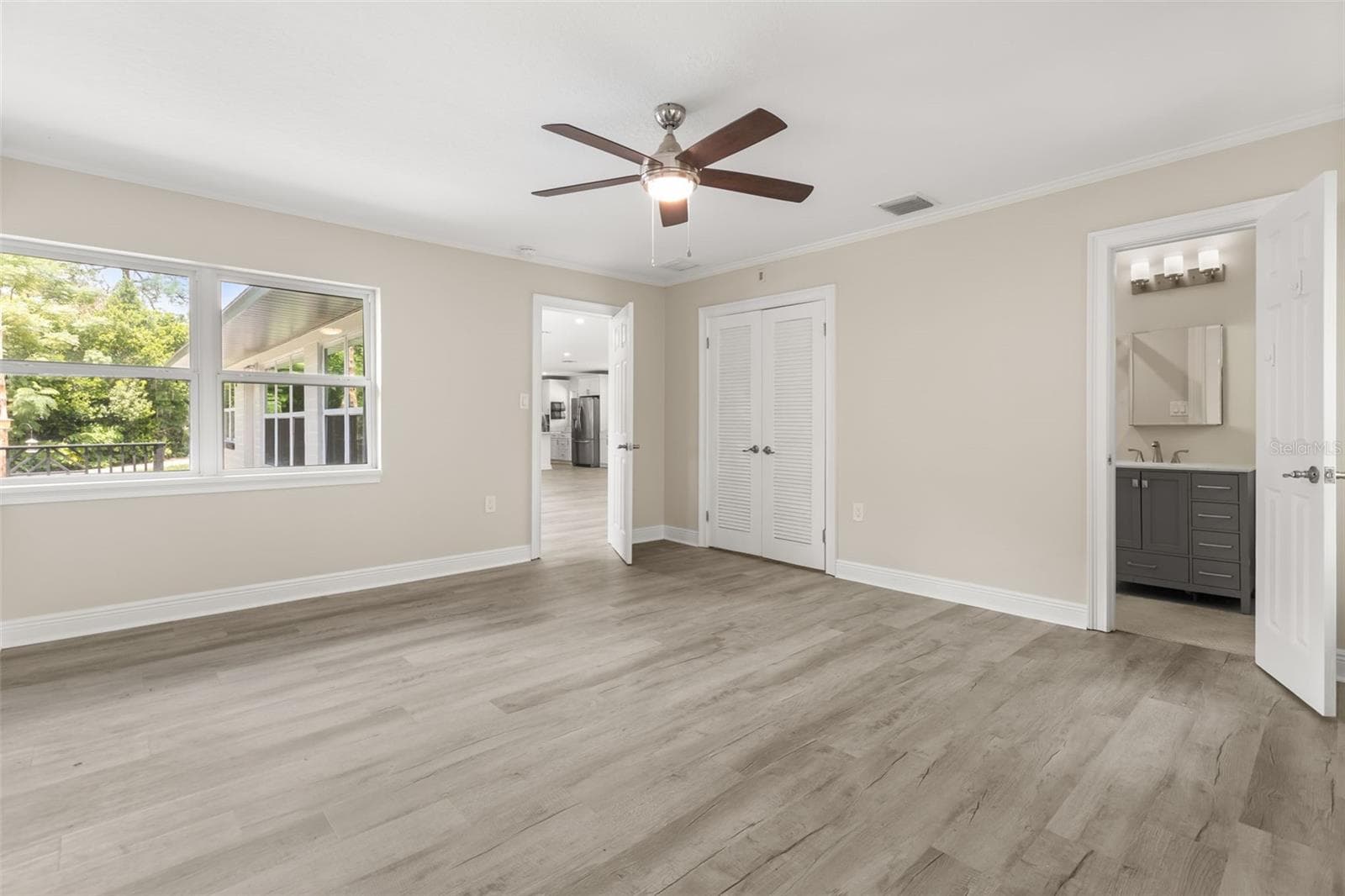 Bedroom 4 with office area and ensuite bathroom - 1602 COUNTRY CLUB RD, EUSTIS