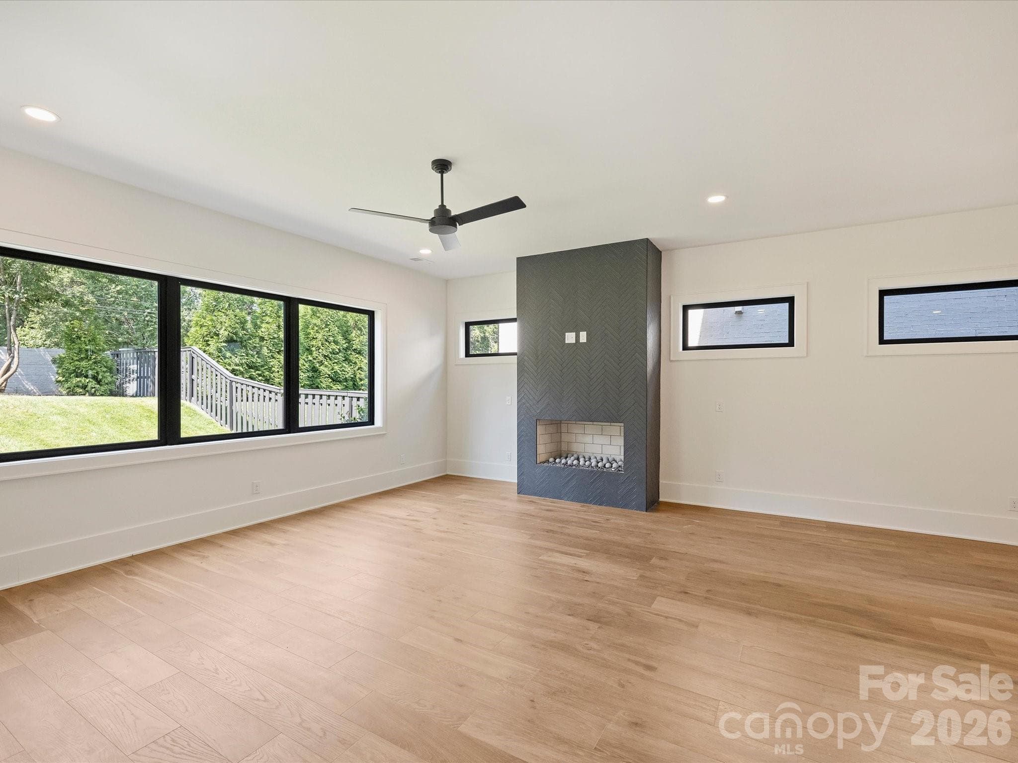 Living area with gas fireplace. - Charlotte