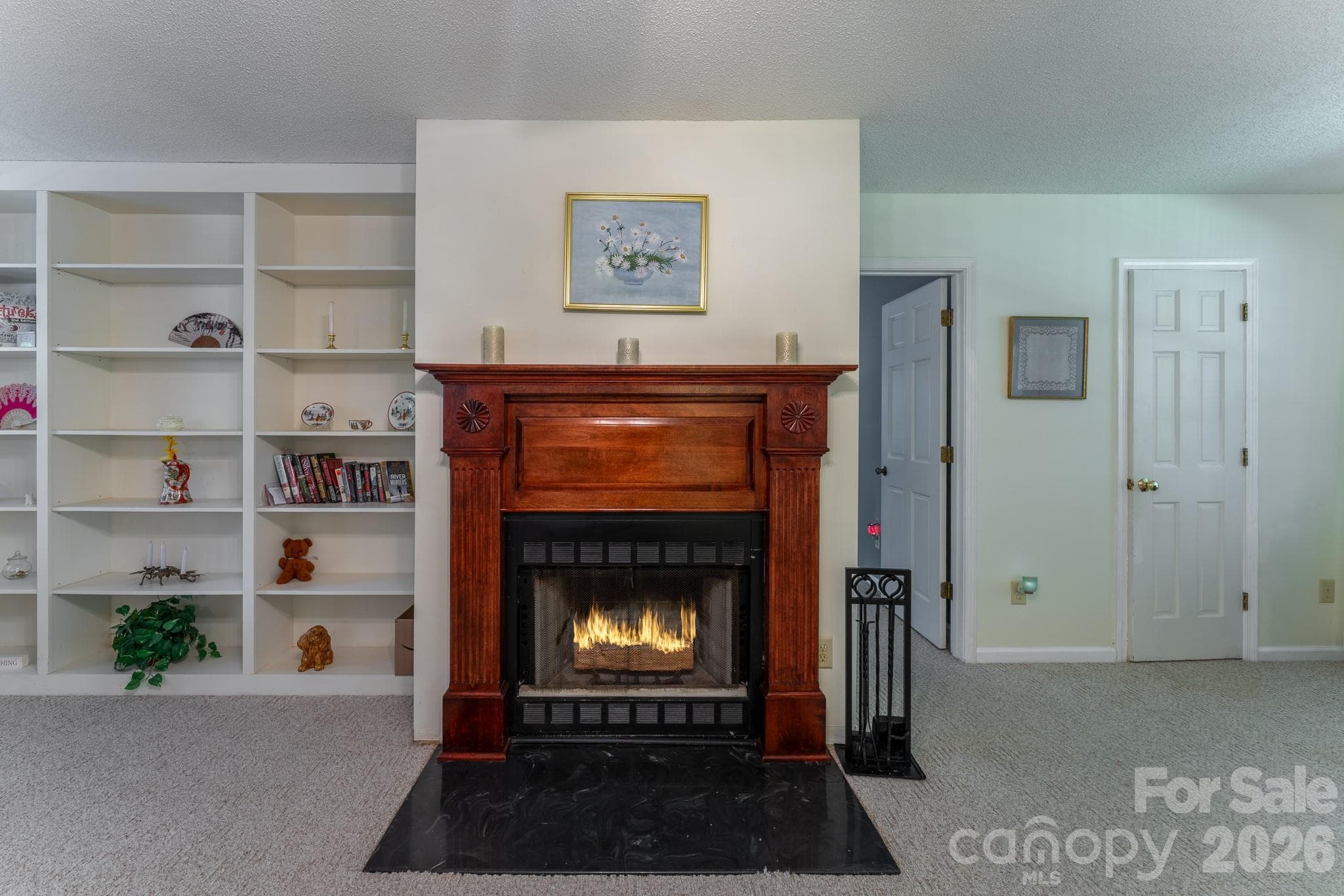 Second half bath is right outside the primary bedroom in living room to the right of the Fireplace - 1886 Tanasee Gap Road, Balsam Grove
