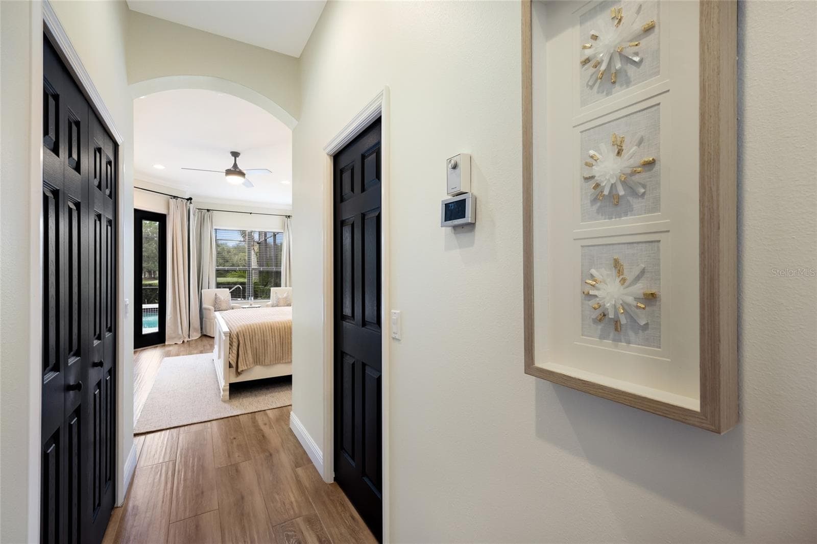 Entry hall to primary suite - 13994 SIENA LOOP, LAKEWOOD RANCH