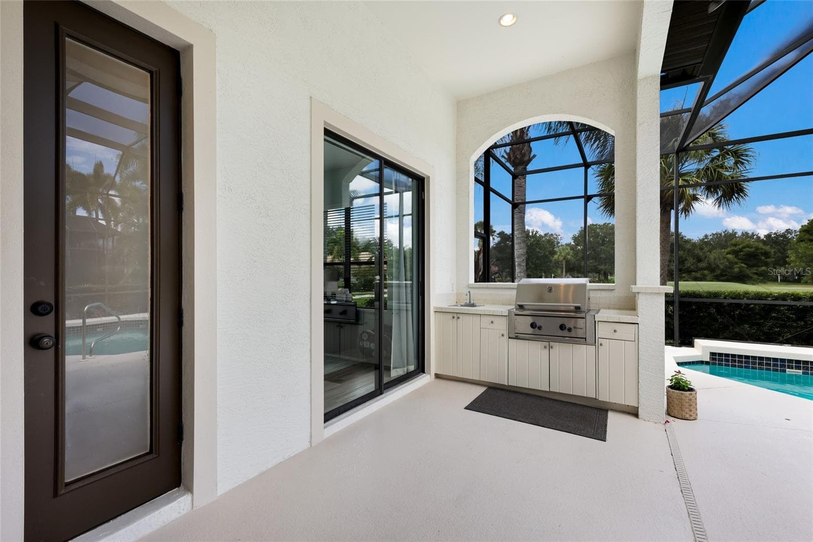 Access to pool bath from lanai - 13994 SIENA LOOP, LAKEWOOD RANCH