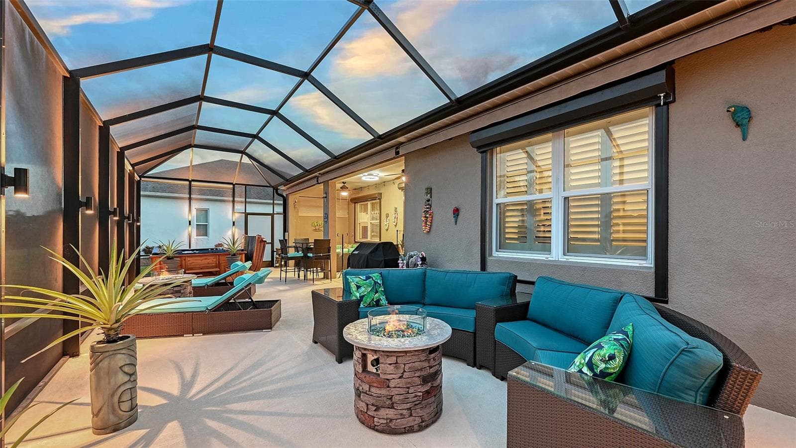 Outdoor entertaining area with pond views - 13667 OLD CREEK CT, PARRISH
