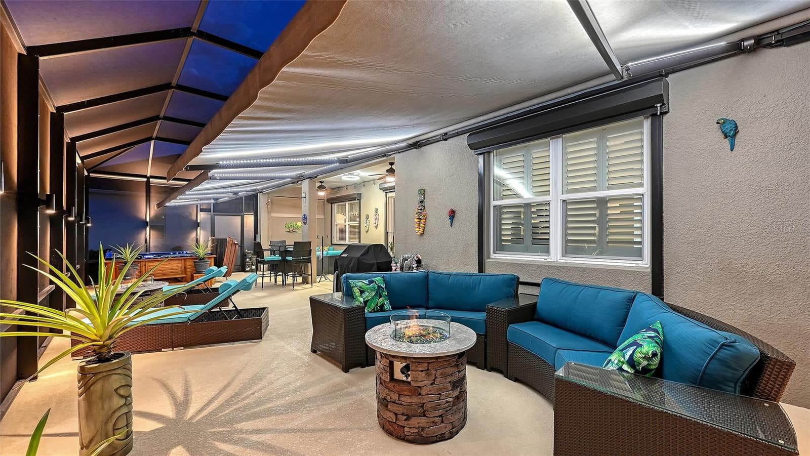Outdoor entertaining area with pond views - 13667 OLD CREEK CT, PARRISH