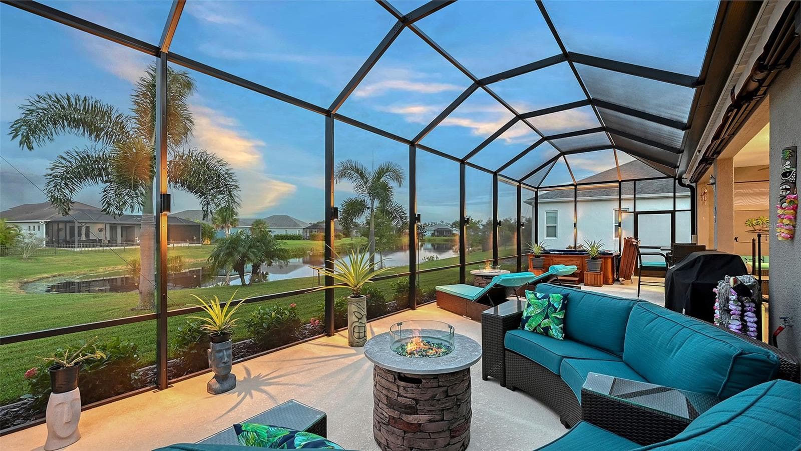 Outdoor entertaining area with pond views - 13667 OLD CREEK CT, PARRISH