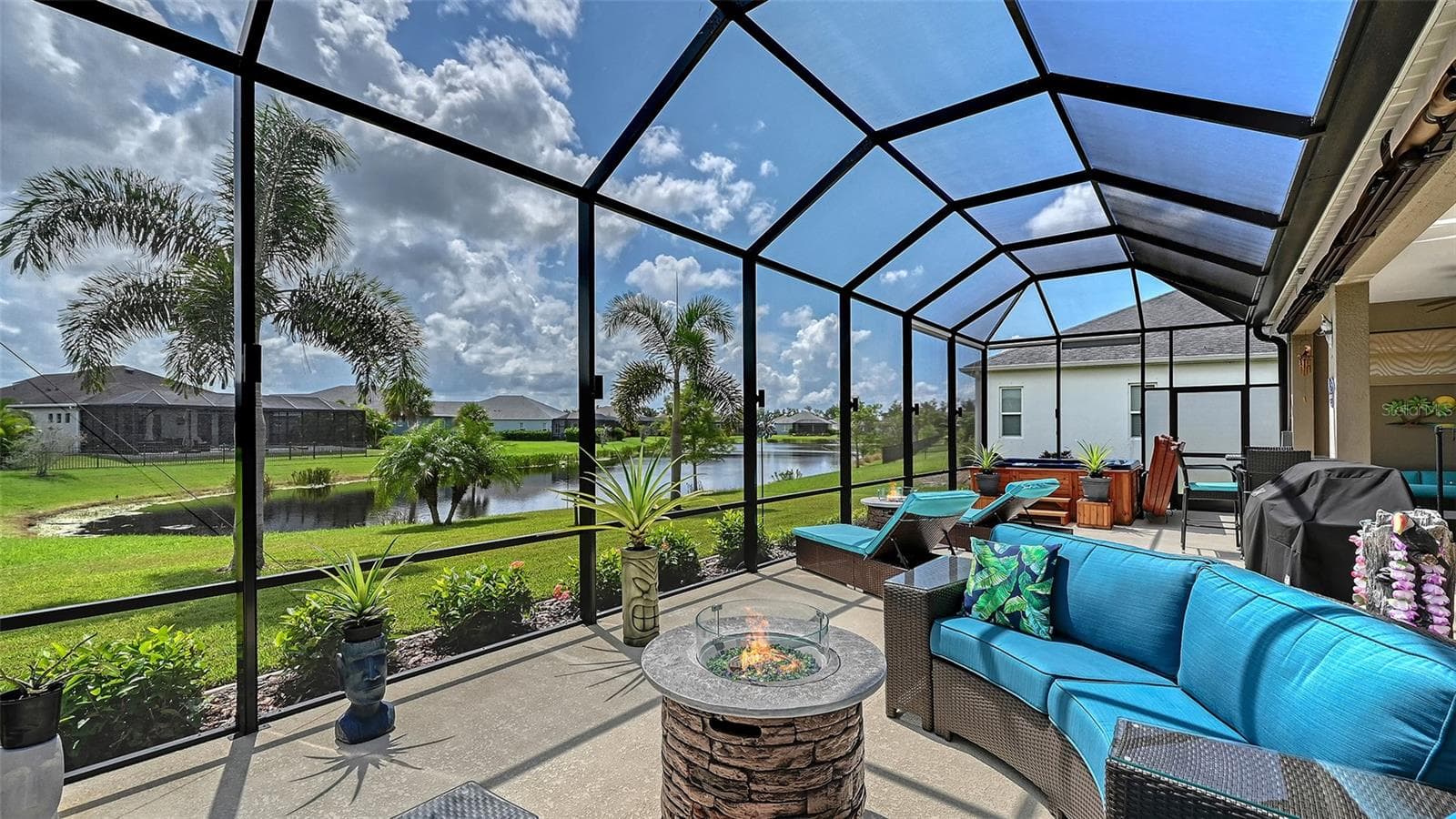 Outdoor entertaining area with pond views - 13667 OLD CREEK CT, PARRISH
