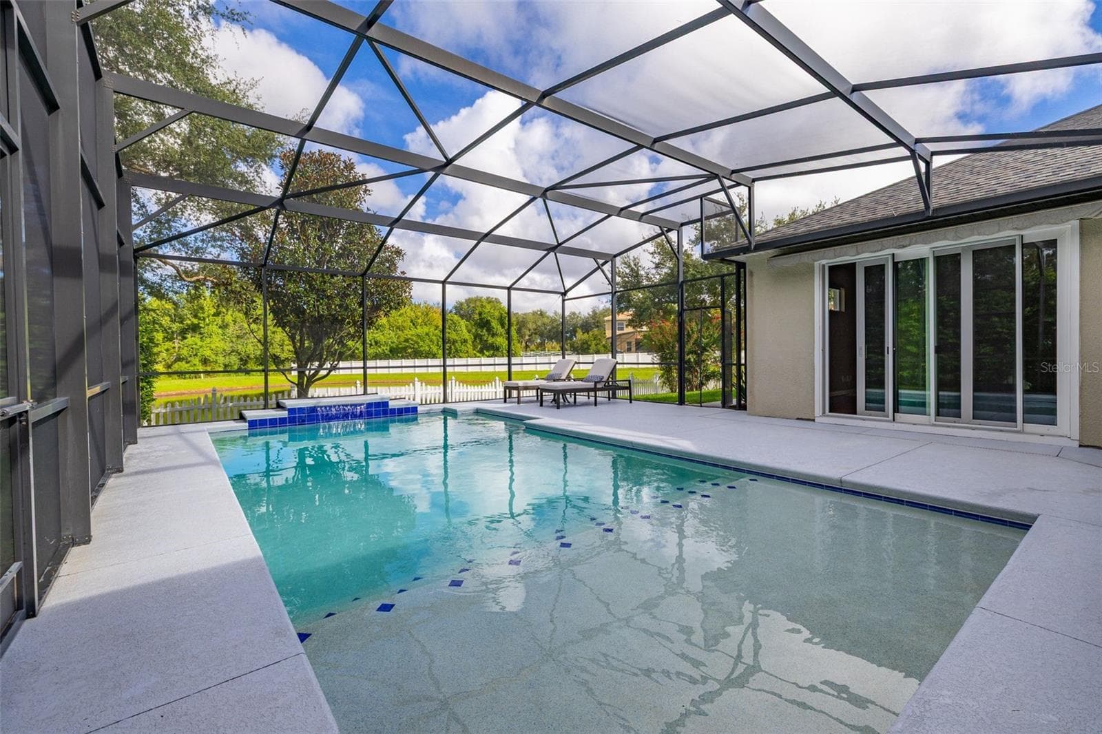More access to the outdoor living by way of sliding glass doors from the family room - 2039 HARBOR COVE WAY, WINTER GARDEN