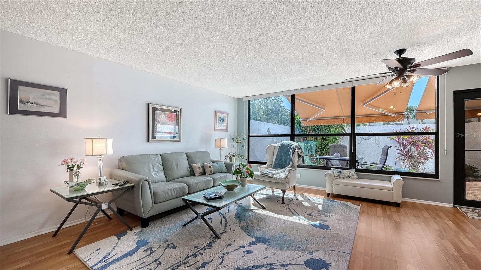 Living room extend into former lanai. Adds about 10 feet to end of living room - 666 WOODLAWN DR #666, BRADENTON