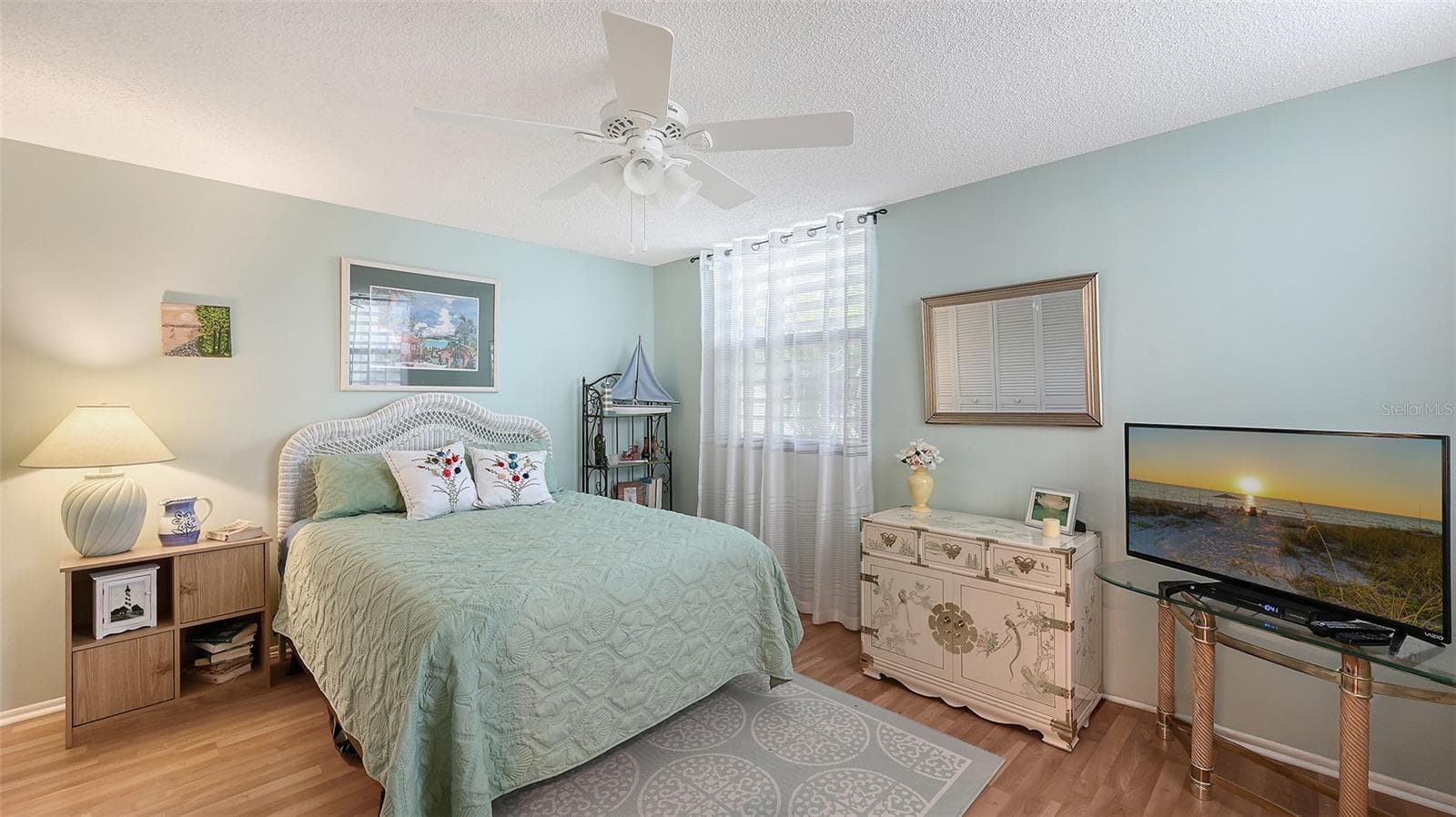 The guest bedroom is light and bright with windows on both exterior walls. - 666 WOODLAWN DR #666, BRADENTON