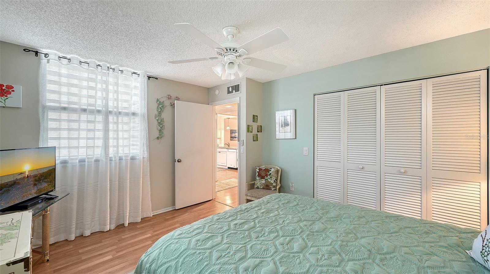 The guest bedroom features a long reach-in closet - 666 WOODLAWN DR #666, BRADENTON