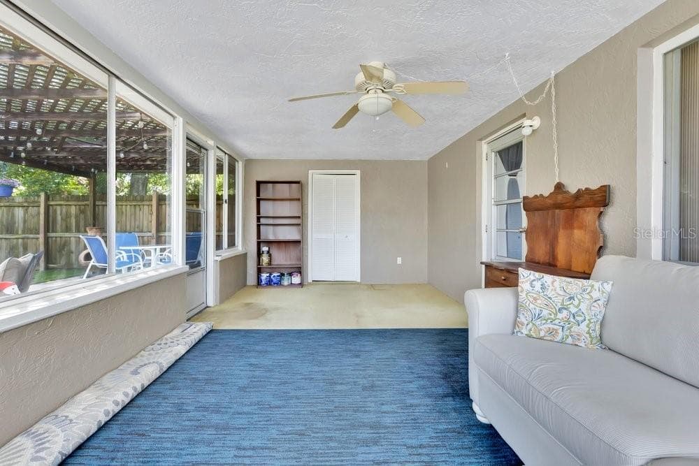 Florida room with laundry utility door in back - 7400 36TH AVE N, ST PETERSBURG